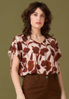 F-DEA028-002-Flower-Print-Viscose-Deadstock-Cream-and-Sienna-Core-Fabrics-model.webp