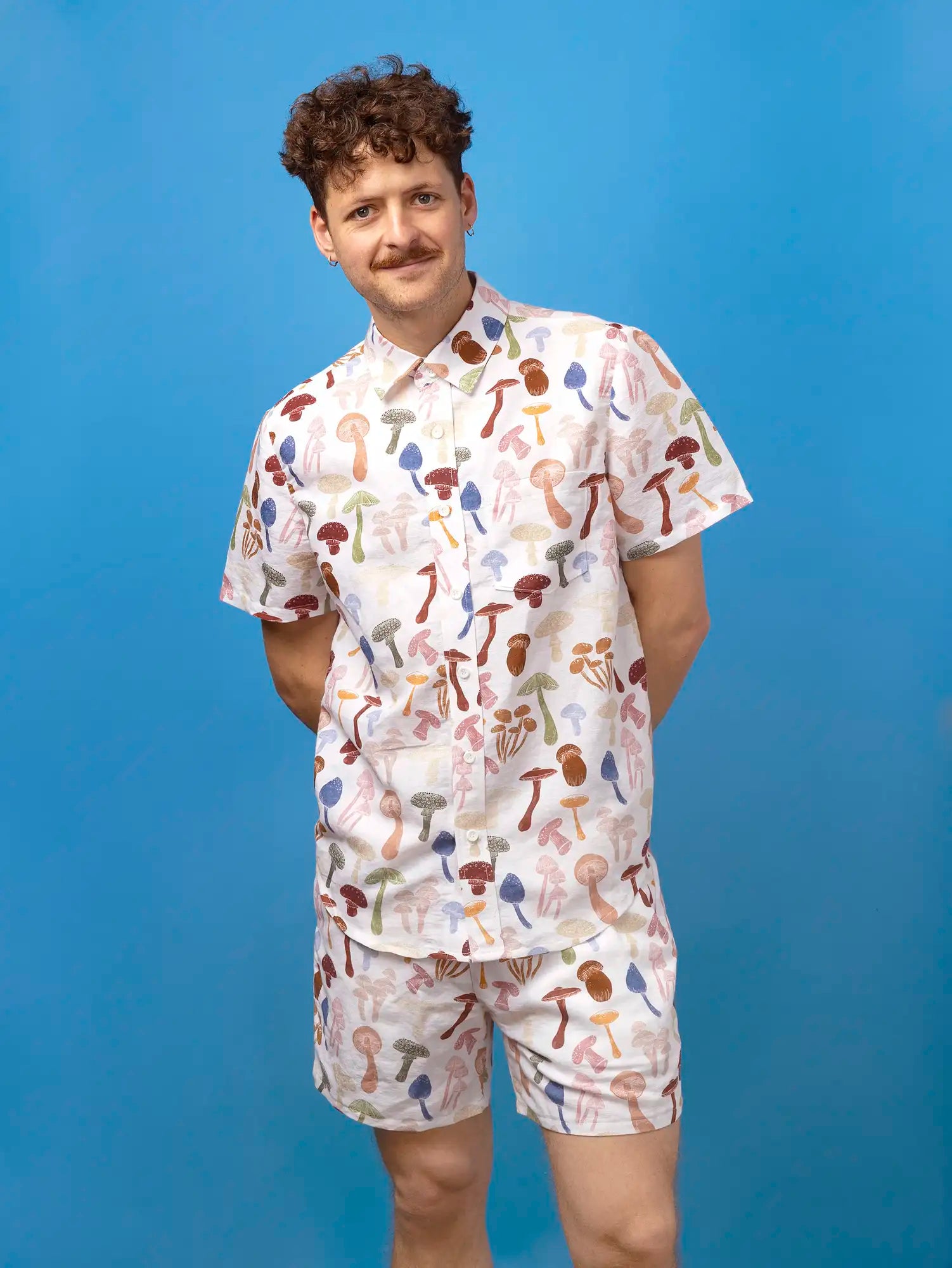 F-COT465-Fun-Guy-Print-Organic-Cotton-Linen-Ivory-and-Multicolour-Core-Fabrics-model.webp
