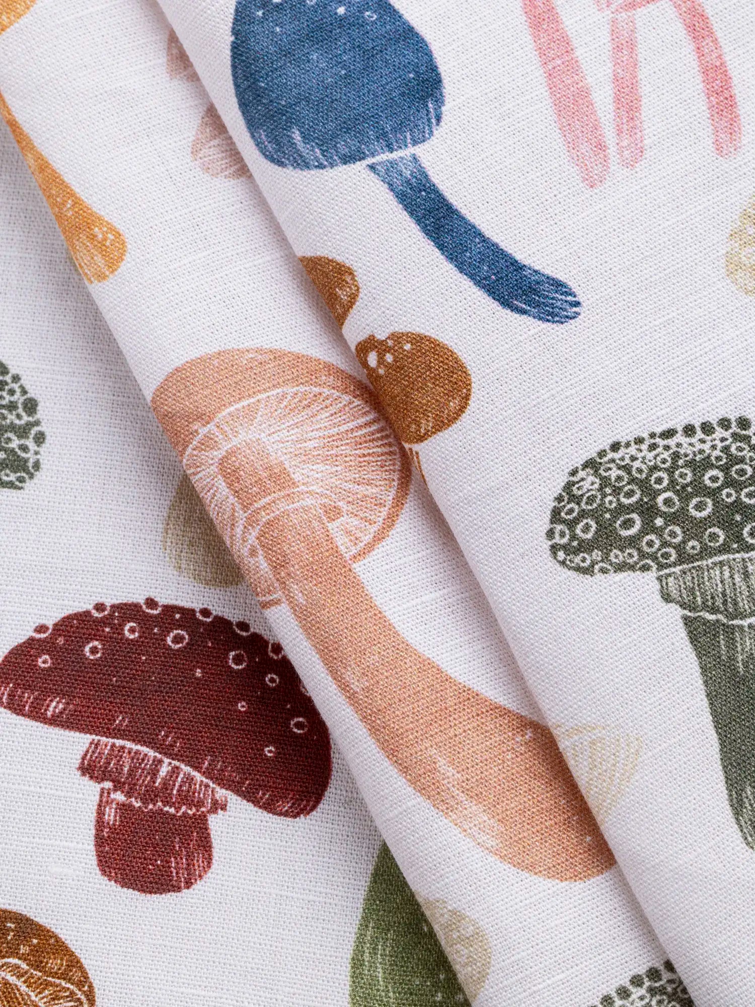 F-COT465-Fun-Guy-Print-Organic-Cotton-Linen-Ivory-and-Multicolour-Core-Fabrics-fold.webp