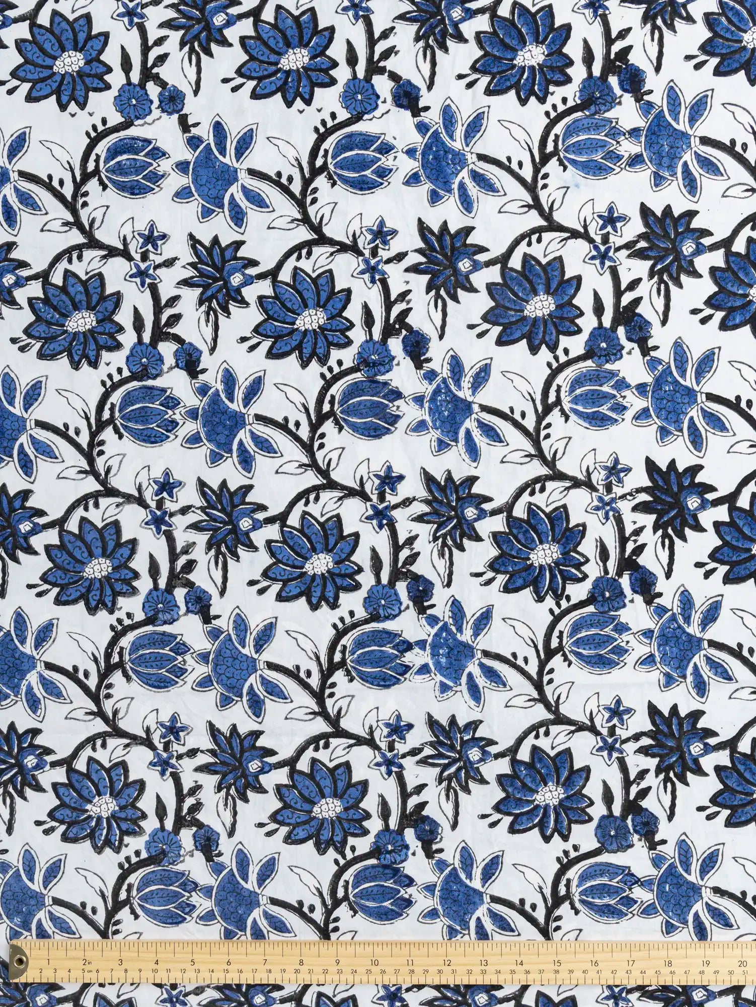 F-COT486-Garden-Floral-Block-Print-Cotton-Poplin-Sky-Indigo-and-Black-Core-Fabrics-ruler.webp