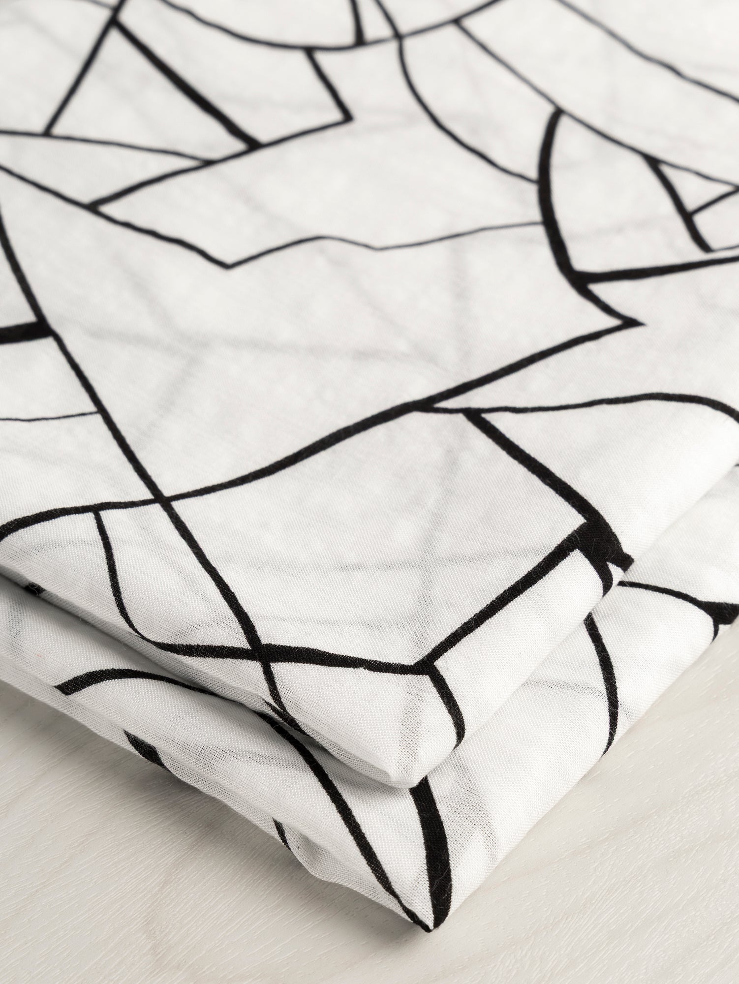 F-DEA059-Geo-Cotton-Voile-Deadstock-White-Black-Core-Fabrics-fold.JPG