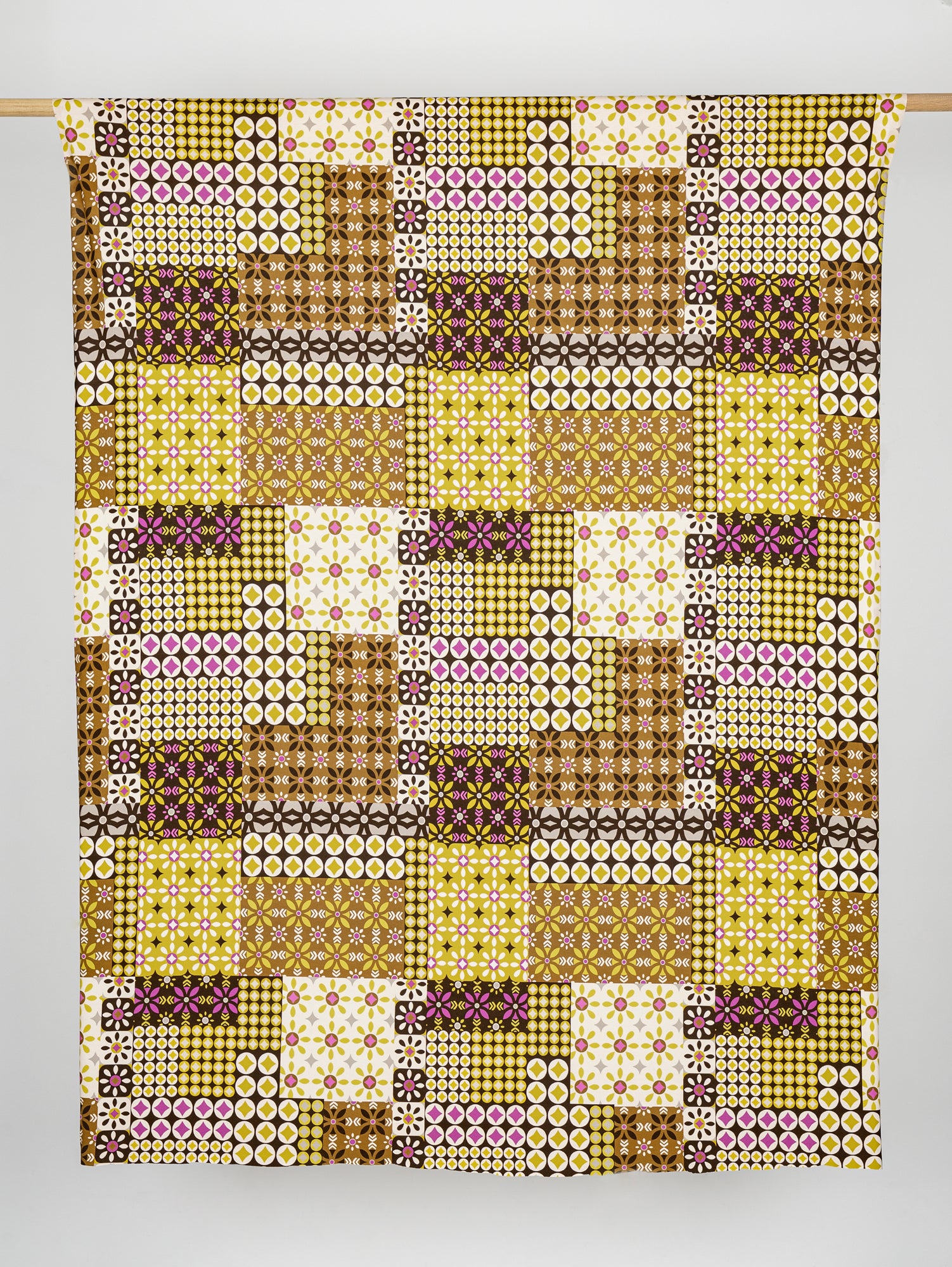 F-VIS265-Geo-Patchwork-Print-Viscose-Knit-Chocolate-Olive-Magenta-Cream-Core-Fabrics-draped.JPG
