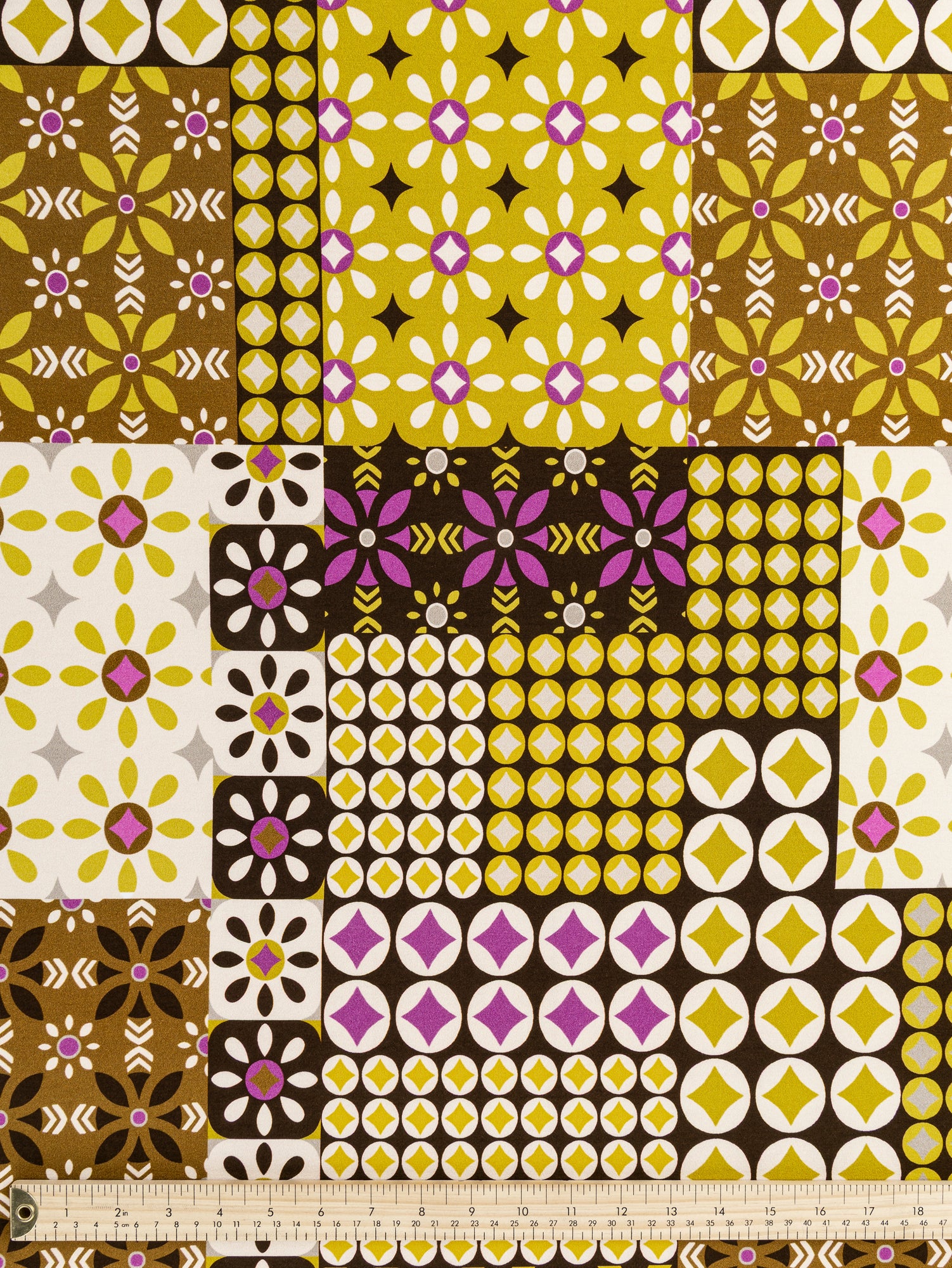 F-VIS265-Geo-Patchwork-Print-Viscose-Knit-Chocolate-Olive-Magenta-Cream-Core-Fabrics-ruler.JPG
