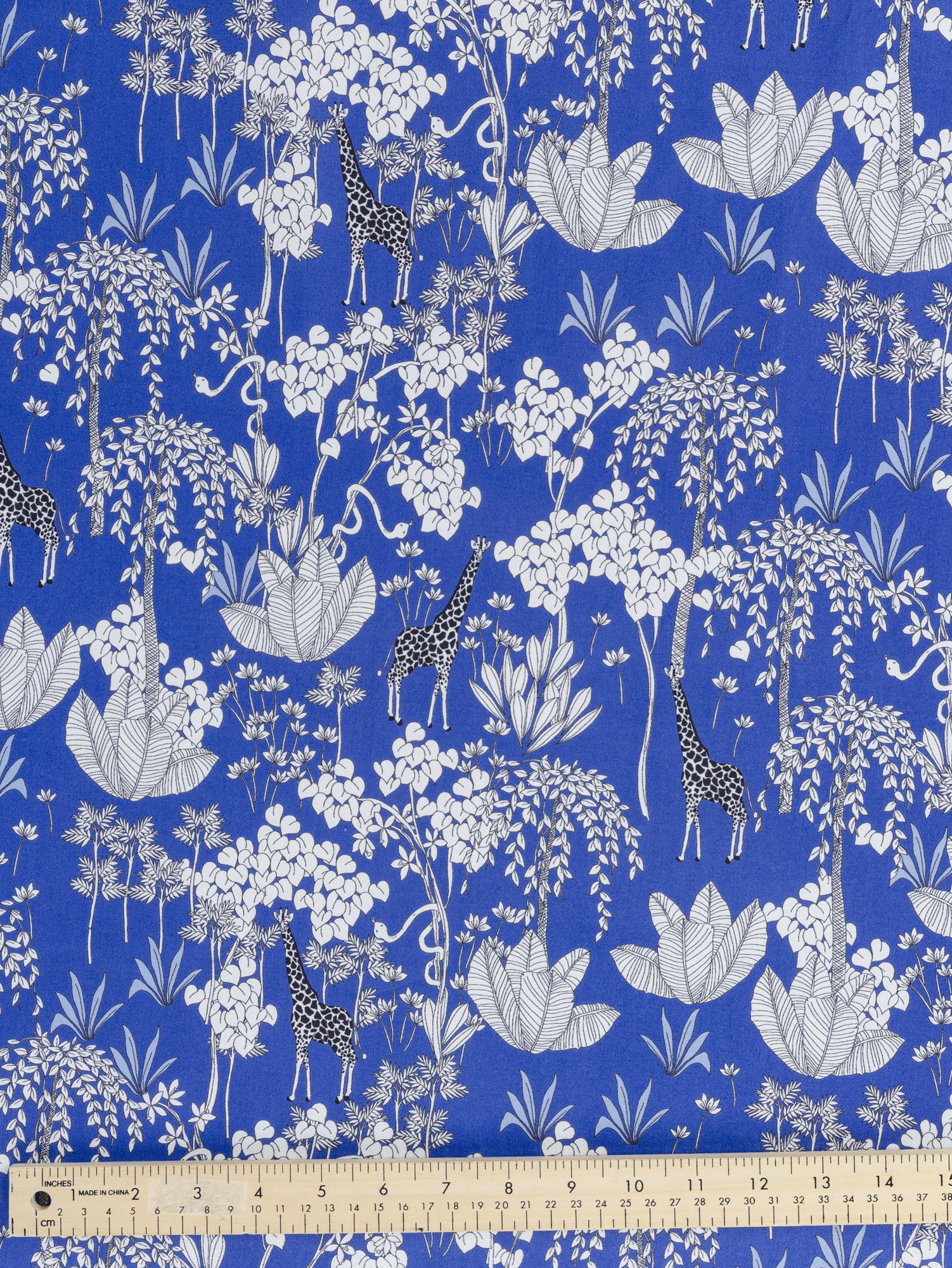 F-COT348-Giraffe-Print-Cotton-Poplin-Blue-Black-and-White-Core-Fabrics-ruler.JPG