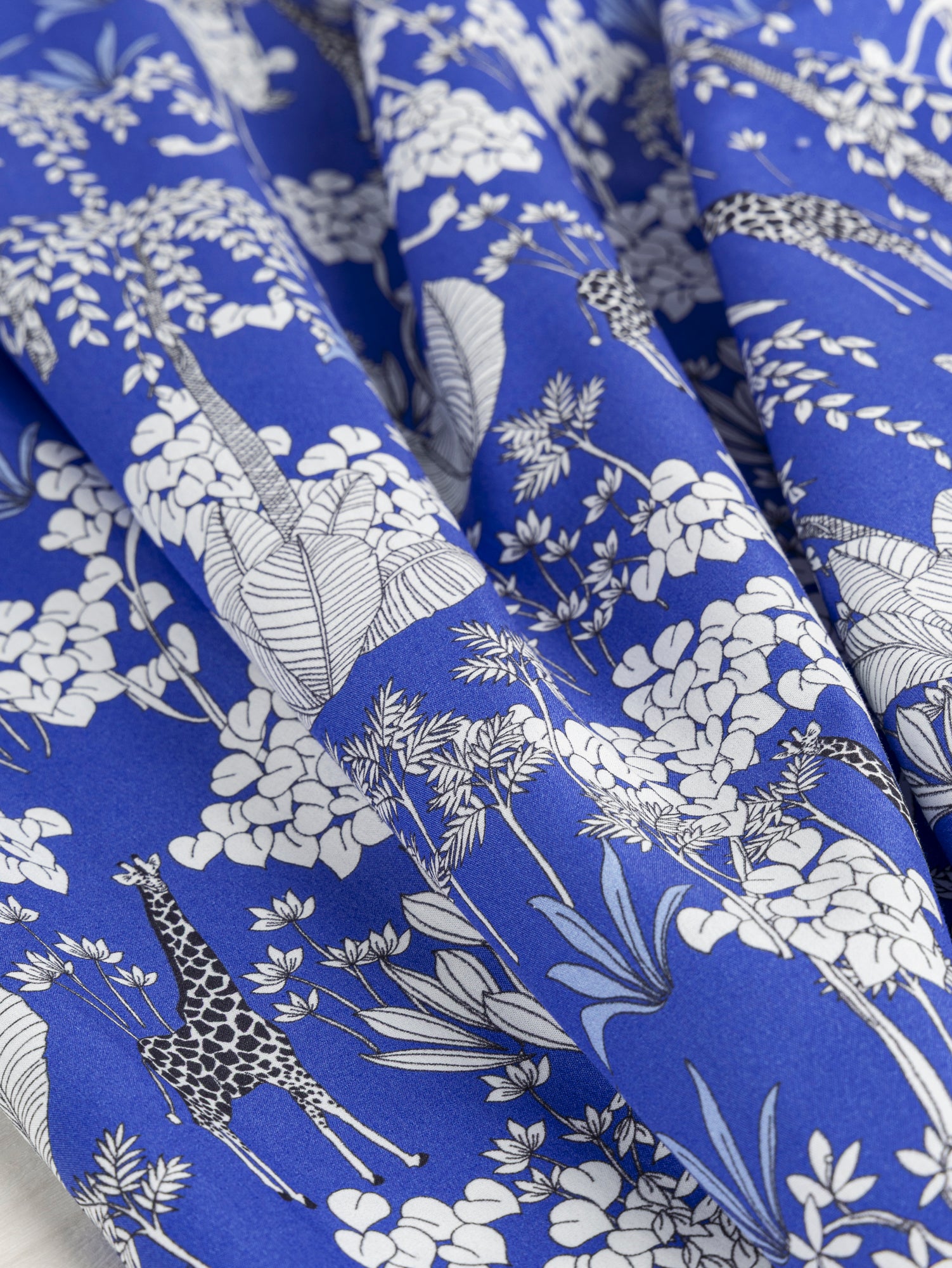 F-COT348-Giraffe-Print-Cotton-Poplin-Blue-Black-and-White-Core-Fabrics-scrunched.JPG