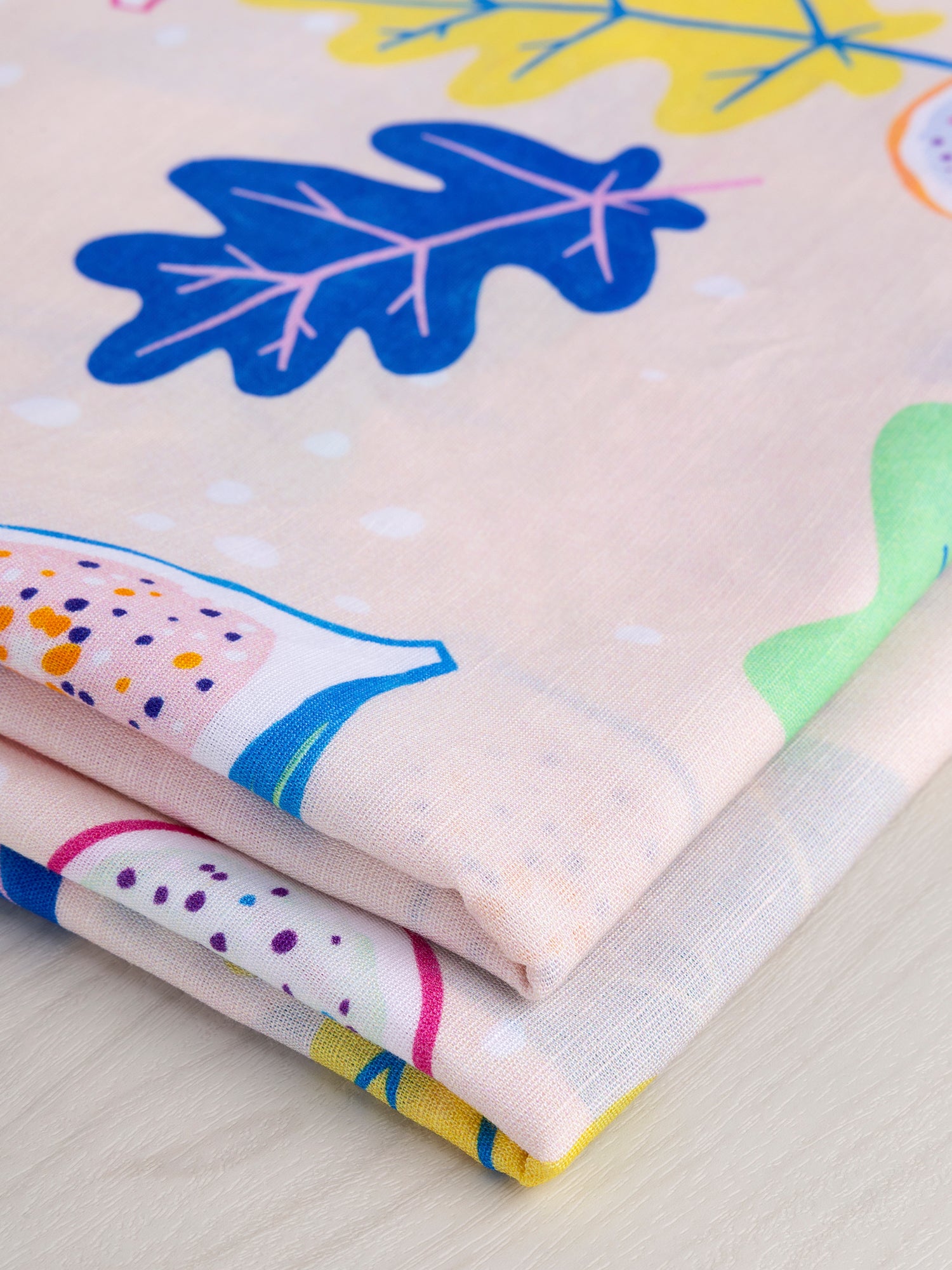 F-COT357-Go-Fig-ure-Print-Organic-Cotton-Linen-Cream- Periwinkle-Light-Green-Eggplant-Core-Fabrics-fold.JPG