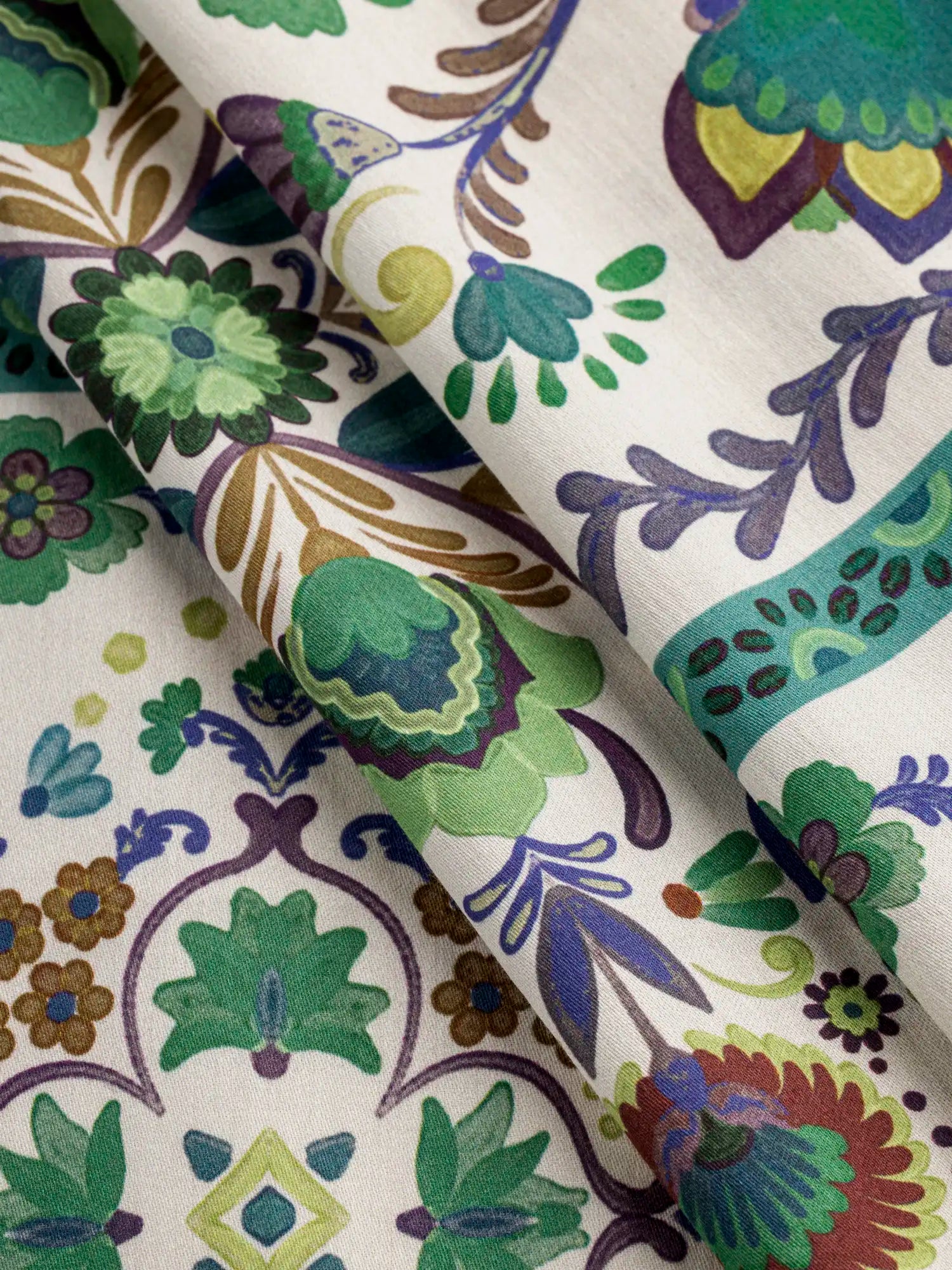 F-COT436-Grand-Garden-Print-BCI-Cotton-Lawn-Cream-Blue-and-Green-Core-Fabrics-fold.webp