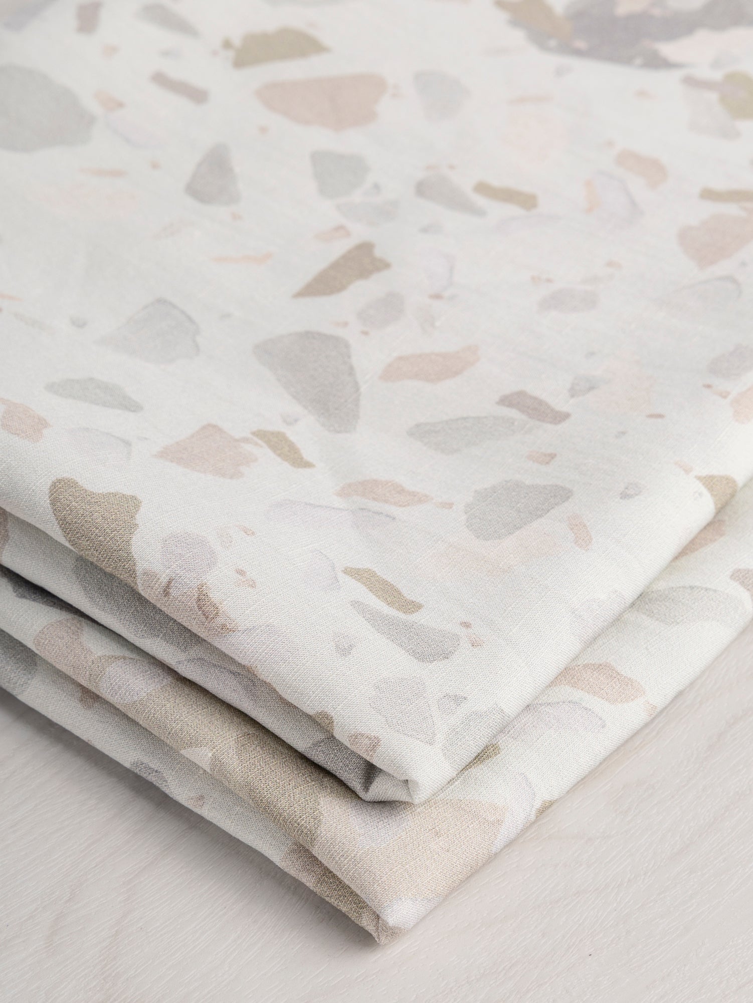 F-DEA031-Granite-Print-Viscose-Linen-Deadstock-Off-White-and-Pastel-Core-Fabrics-fold.JPG