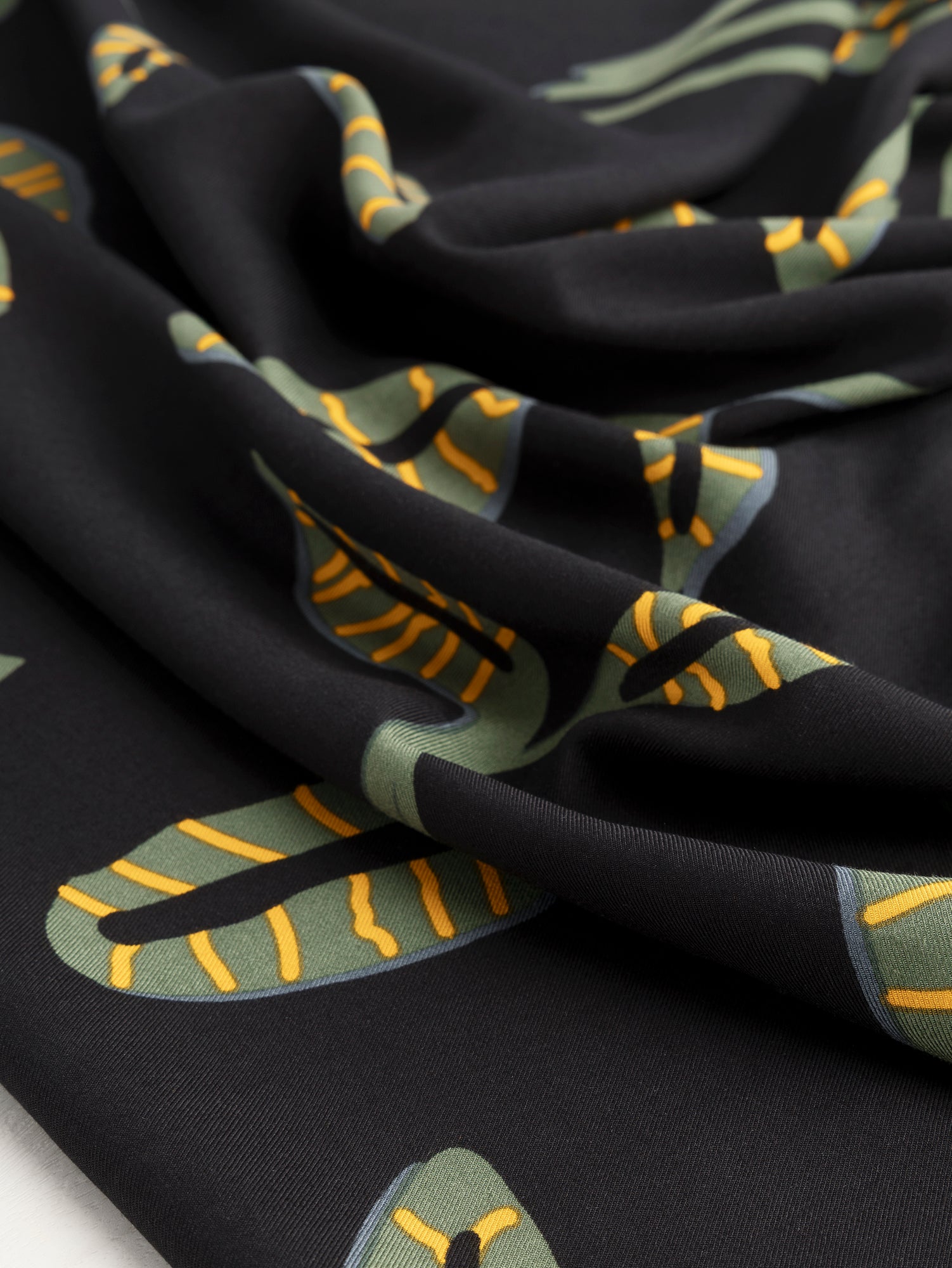 F-DEA060-Graphic-Leaf-Viscose-Twill-Deadstock- Black + Olive + Yellow-Core-Fabrics-scrunched.JPG