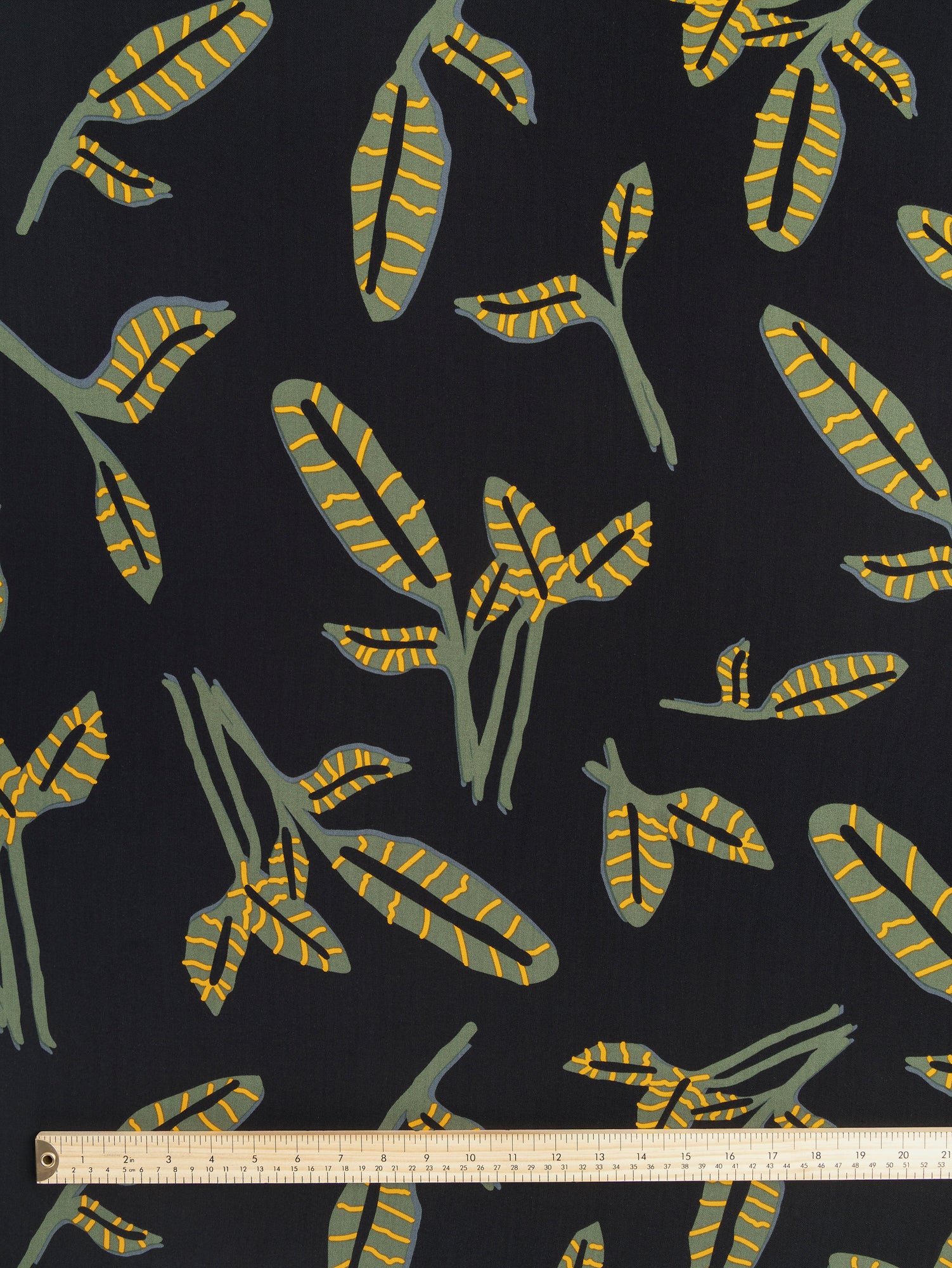 F-DEA060-Graphic-Leaf-Viscose-Twill-Deadstock- Black + Olive + Yellow-Core-Fabrics-ruler.JPG