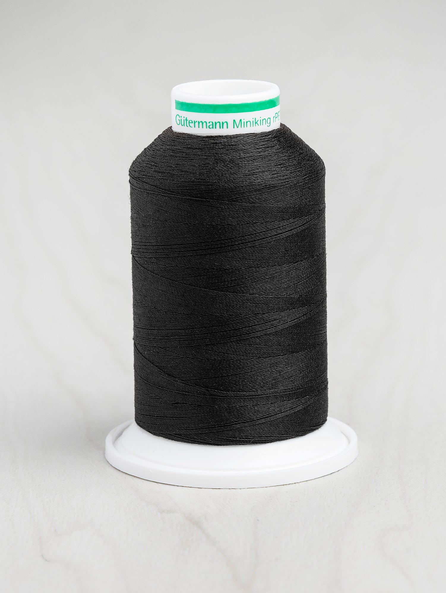 T-rPET003-000-Gütermann-Serger-rPET-Recycled-Thread-Black-Core-Fabrics.JPG