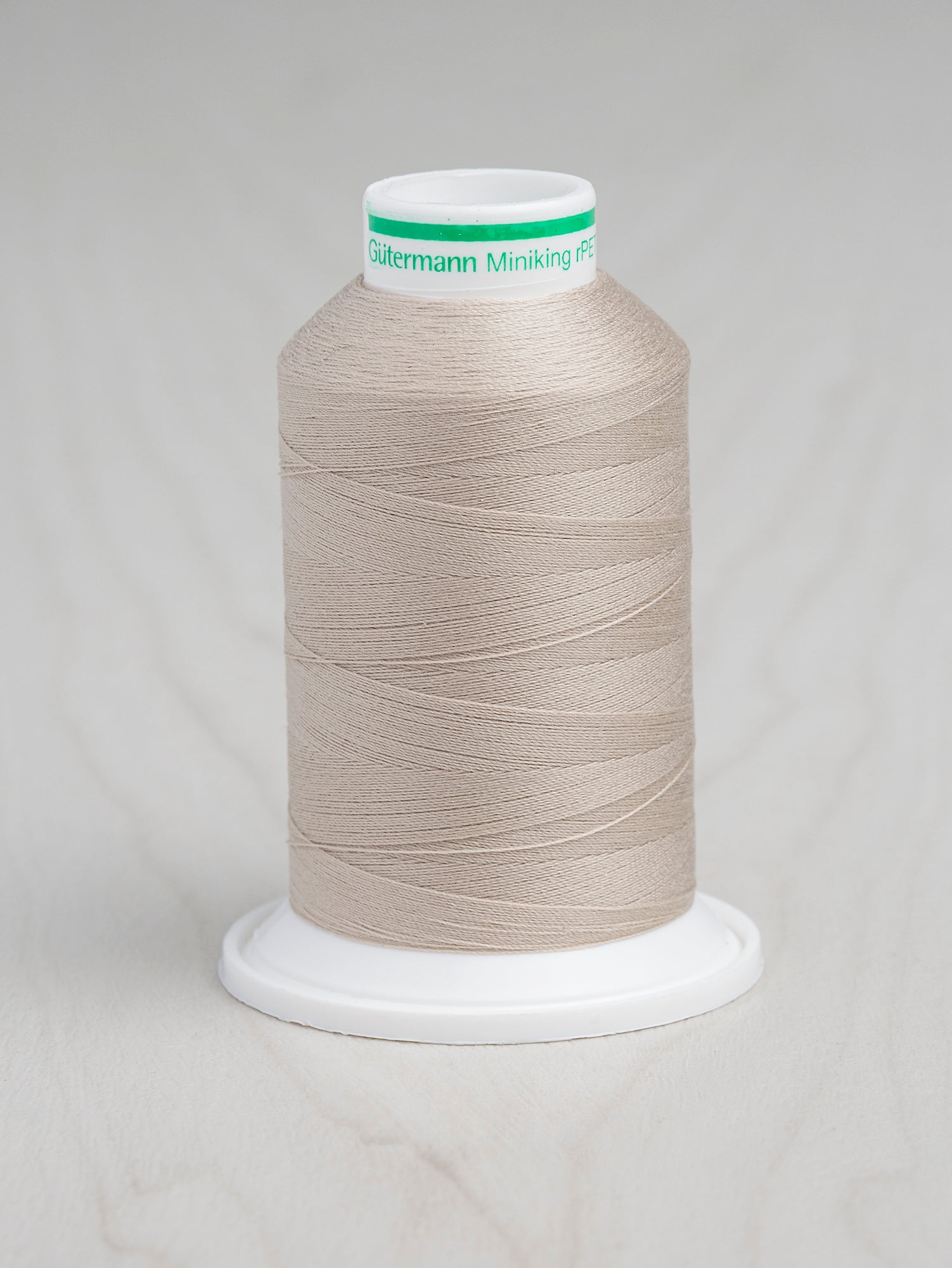 T-rPET003-722-Gütermann-Serger-rPET-Recycled-Thread-Dark-Ivory-Core-Fabrics.JPG