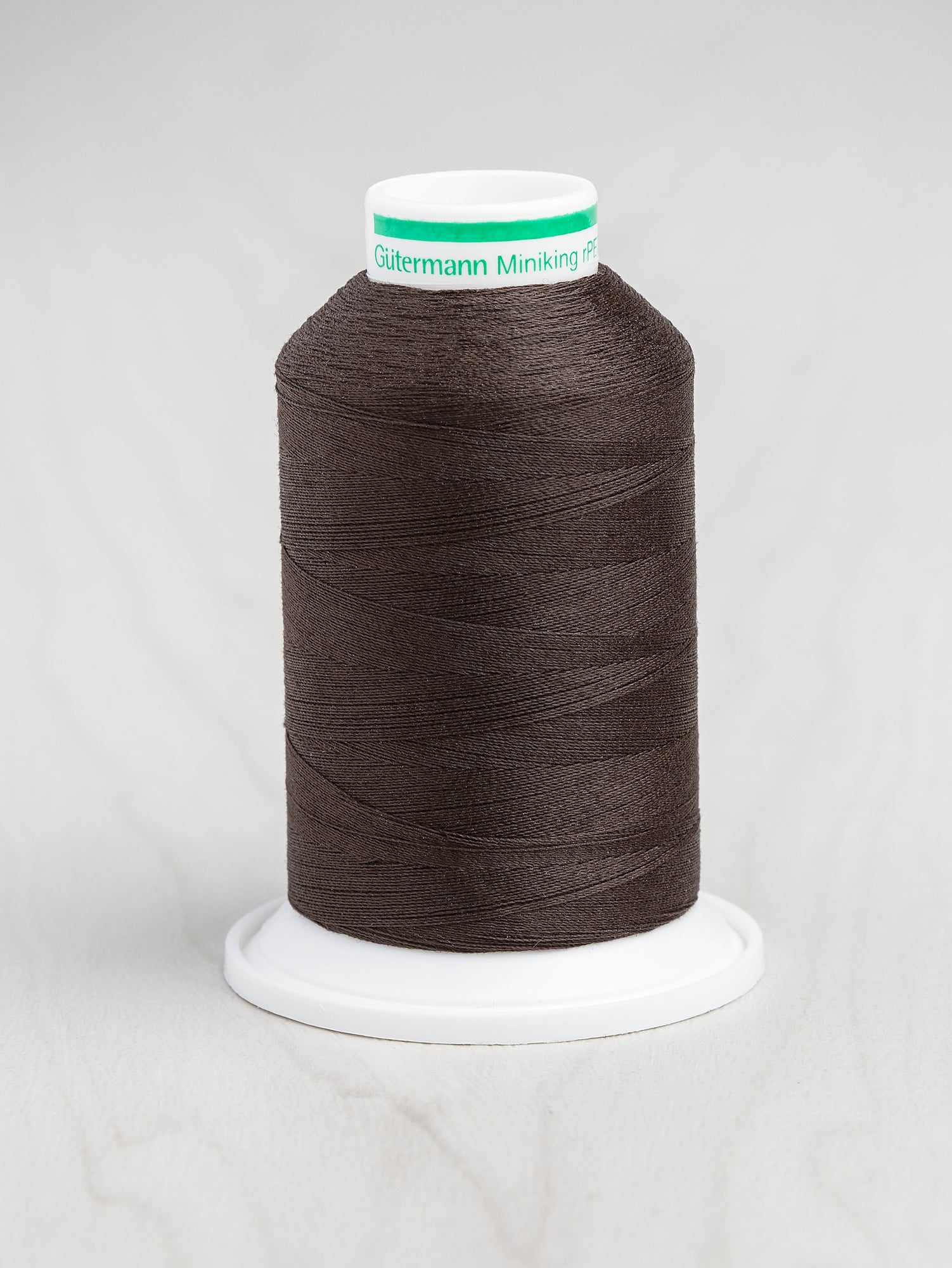 T-rPET003-696-Gütermann-Serger-rPET-Recycled-Thread-Warm-Black-Core-Fabrics.JPG