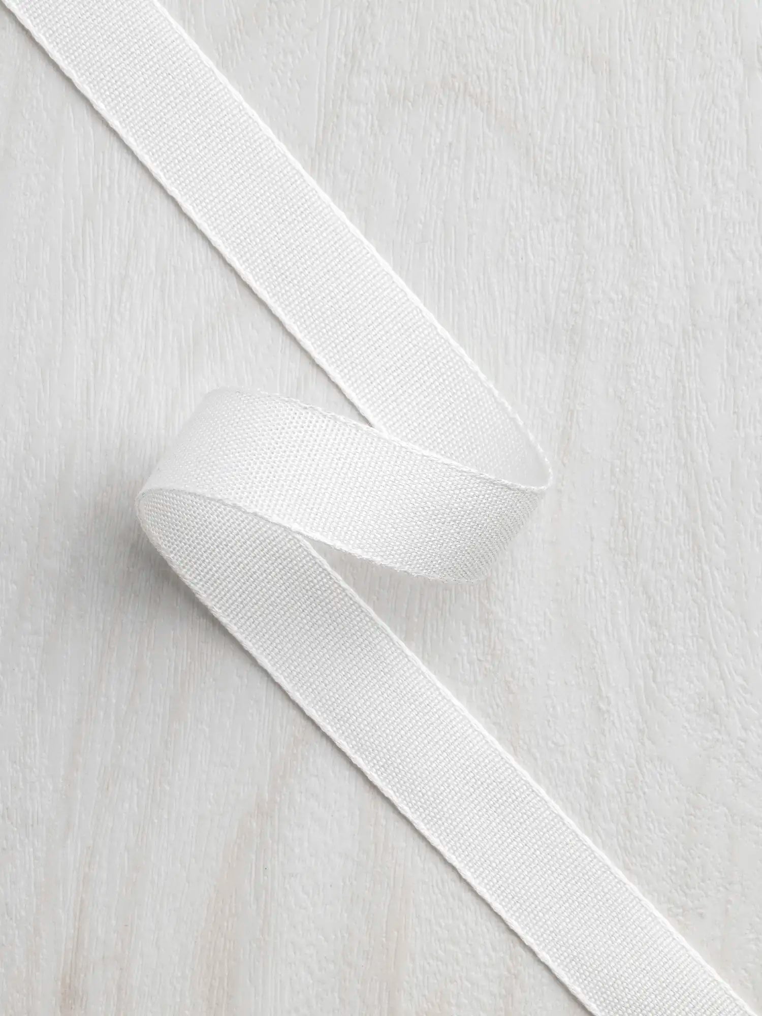 N-TAP016-002-Tencel-Lyocell-Grosgrain-Ribbon-16mm-Ivory-Core-Fabrics.webp
