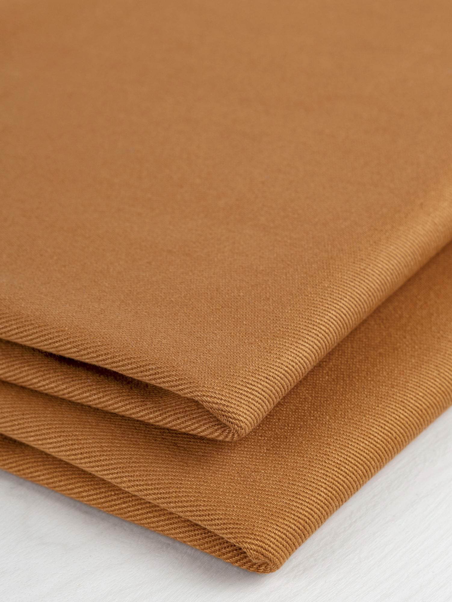 F-COT350-004-Heavyweight-Organic-Cotton-Twill-Caramel-Core-Fabrics-fold.JPG