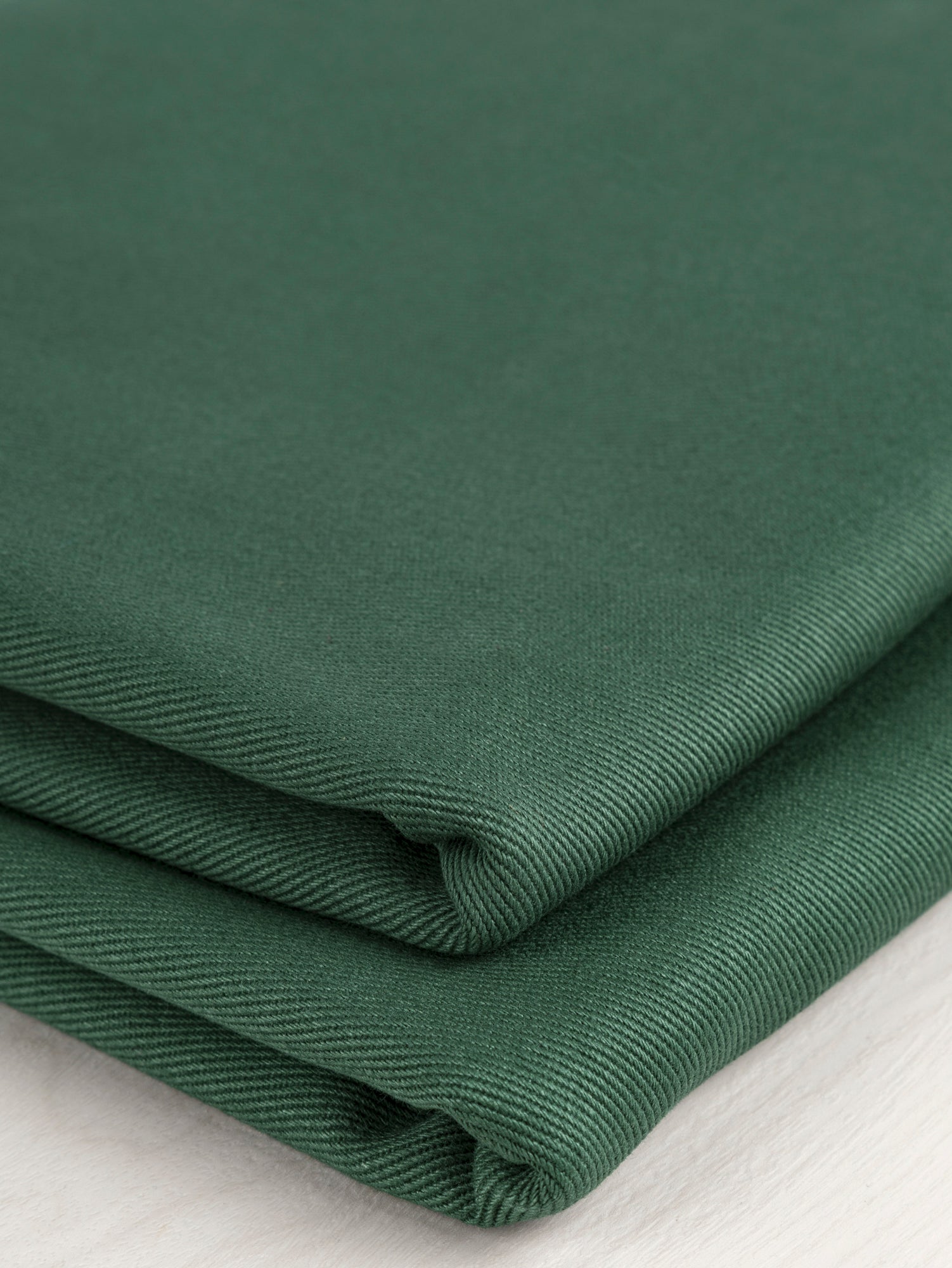 F-COT350-003-Heavyweight-Organic-Cotton-Twill-Forest-Green-Core-Fabrics-fold.JPG