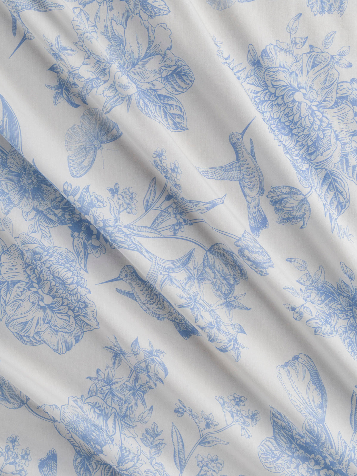 F-COT499-Hummingbird-Toile-de-Jouy-Print-Cotton-Poplin-Ivory-and-Chambray-Core-Fabrics-scrunched.webp