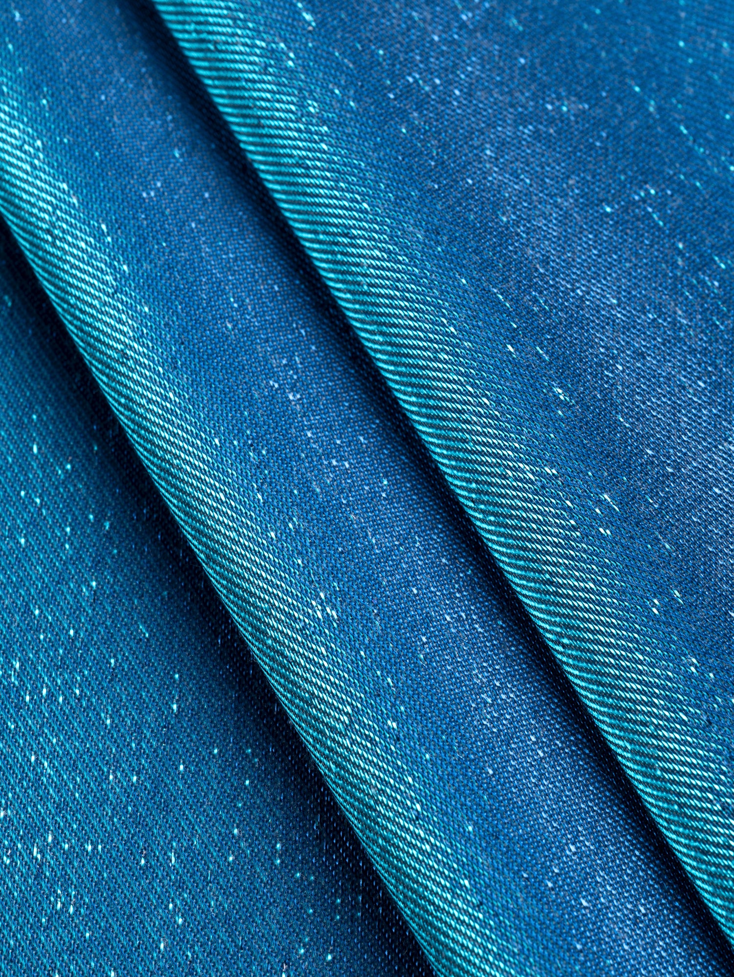 F-DEA104-Iridescent-Lamé-Stretch-Twill-Turquoise-Blue-Core-Fabrics-fold.JPG