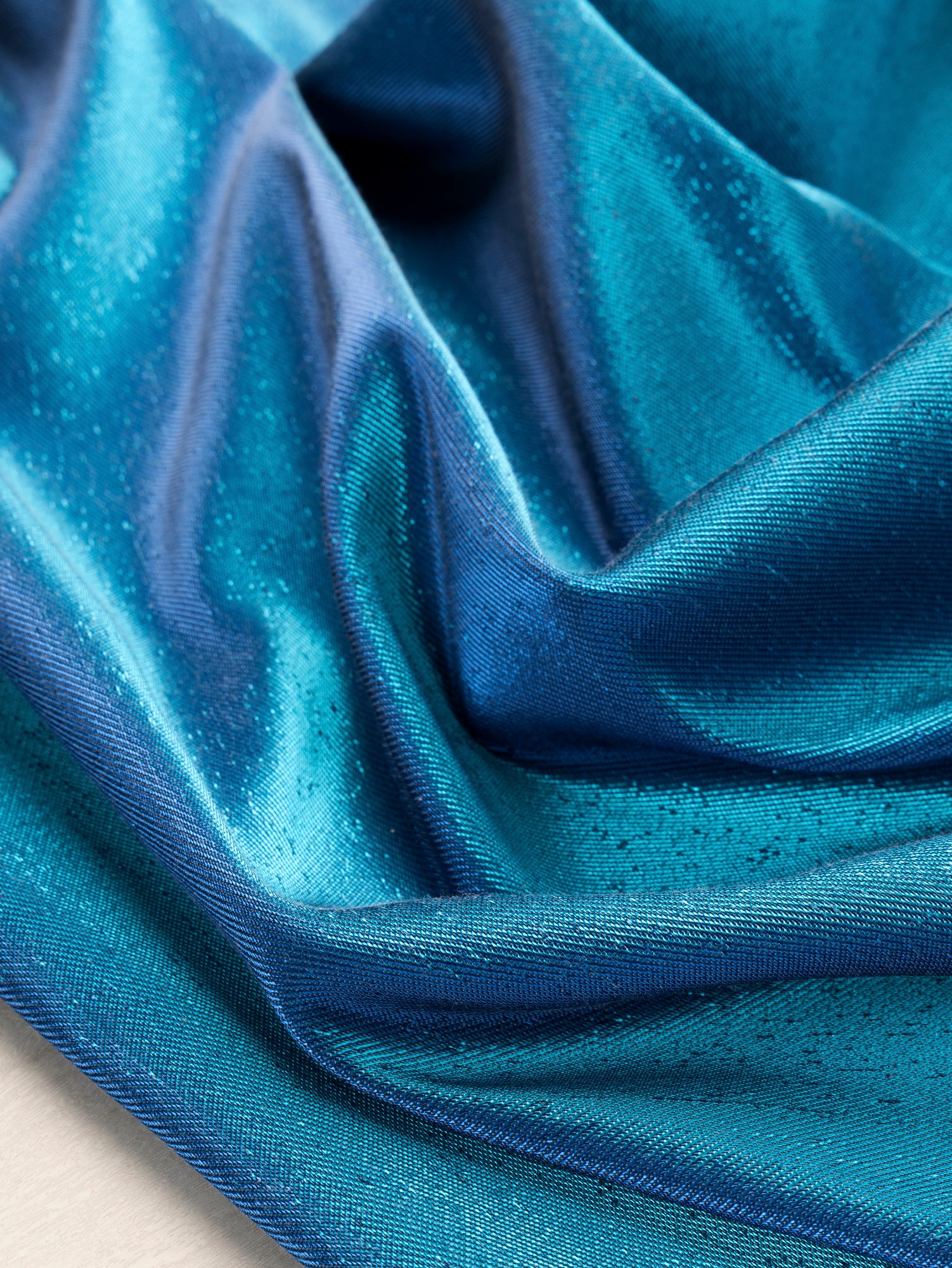 F-DEA104-Iridescent-Lamé-Stretch-Twill-Turquoise-Blue-Core-Fabrics-scrunched.JPG