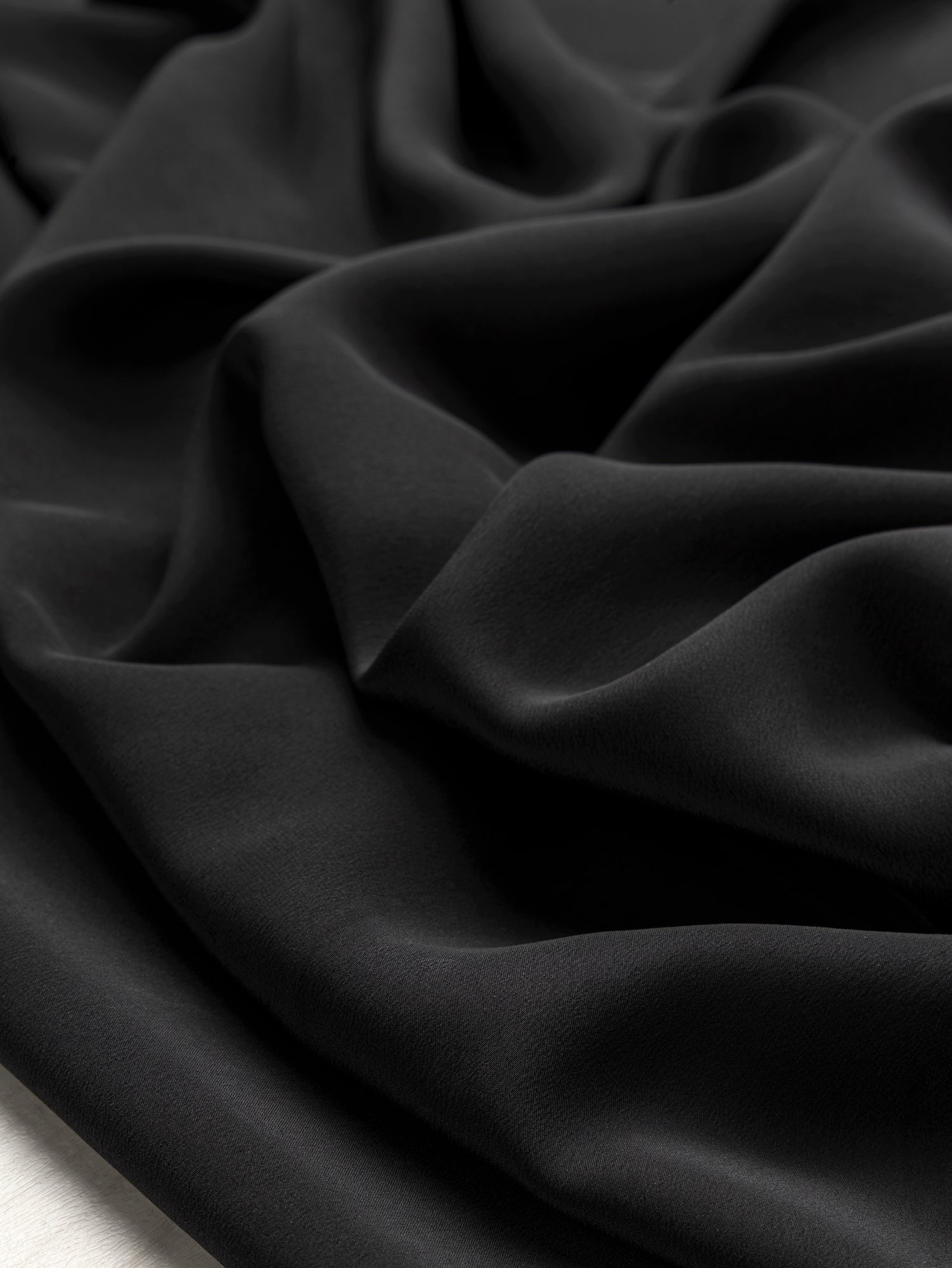 F-SIL034-Italian-Silk-Crepe-de-Chine-Deadstock-Black-Core-Fabrics-scrunched.JPG