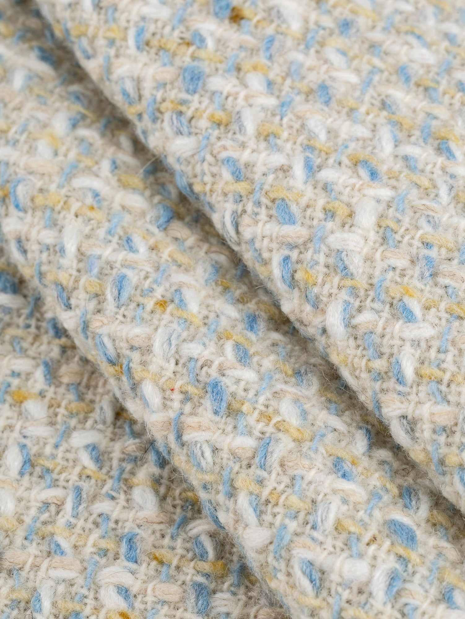 F-WOL130-Italian-Wool-Bouclé-Tweed-Deadstock-Cream-Cornflower-and-Butter-Yellow-Core-Fabrics-fold.JPG