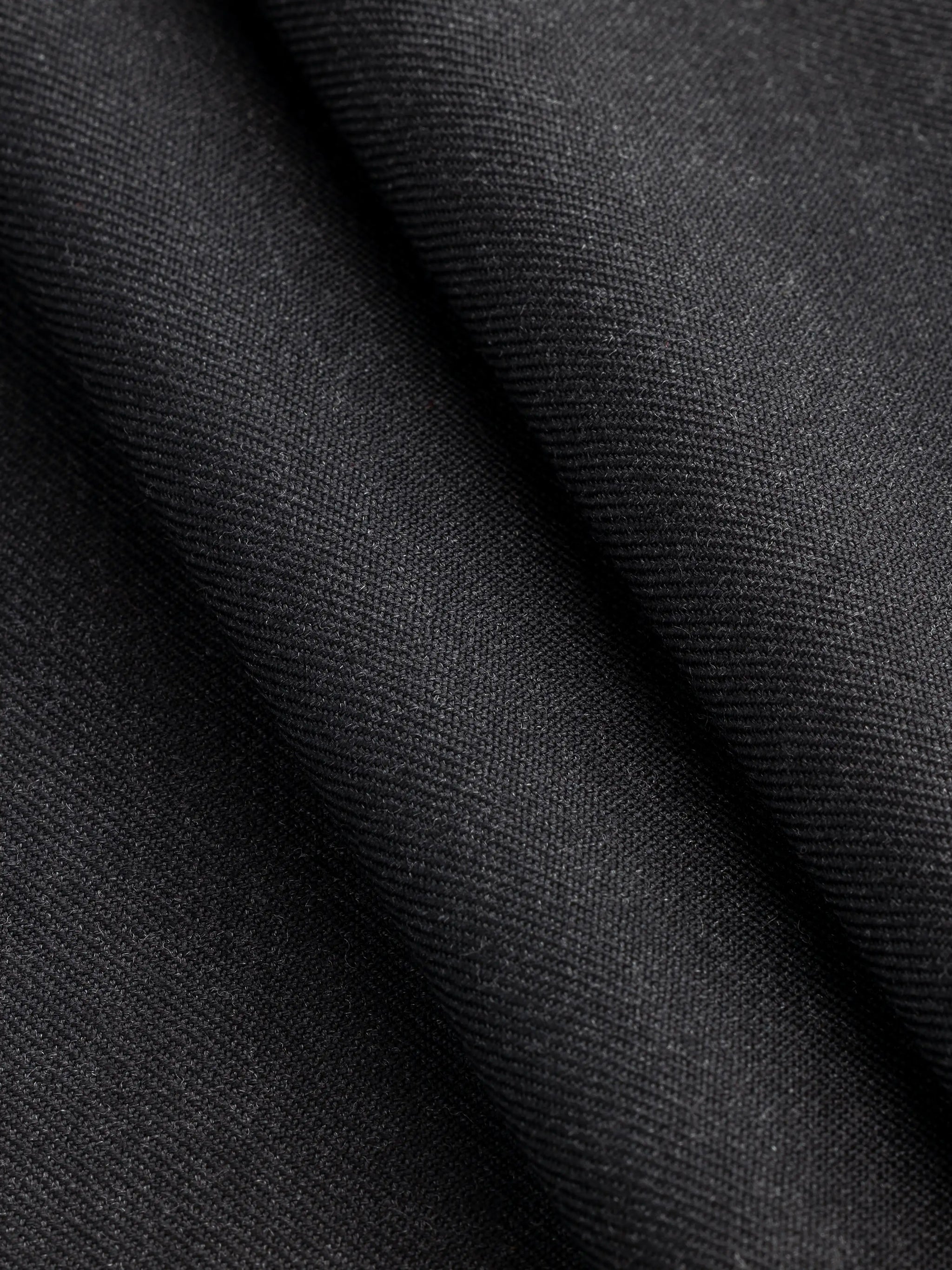 F-WOL120-Italian-Wool-Twill-Suiting-Deadstock-Charcoal-Core-Fabrics-fold.webp