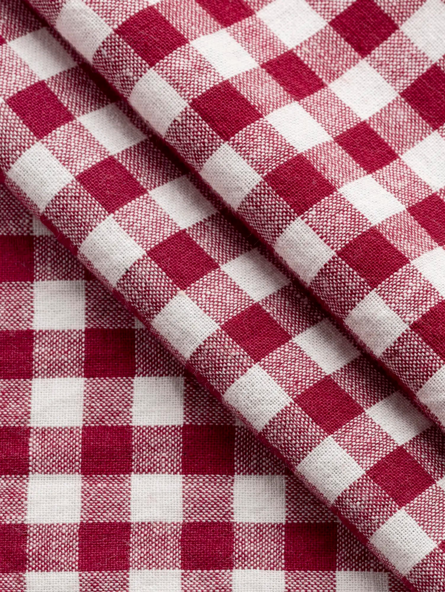 F-COT352-011-Jam-Handwoven-Gingham-Cotton-Rhubarb-and-Ivory-Core-Fabrics-fold.webp