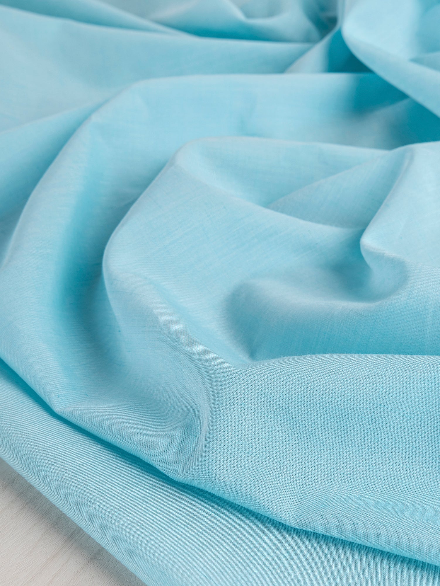 F-TEN016-004-Japanese-Tencel-Cotton-Voile-Sky-Blue-Core-Fabrics-scrunched.JPG