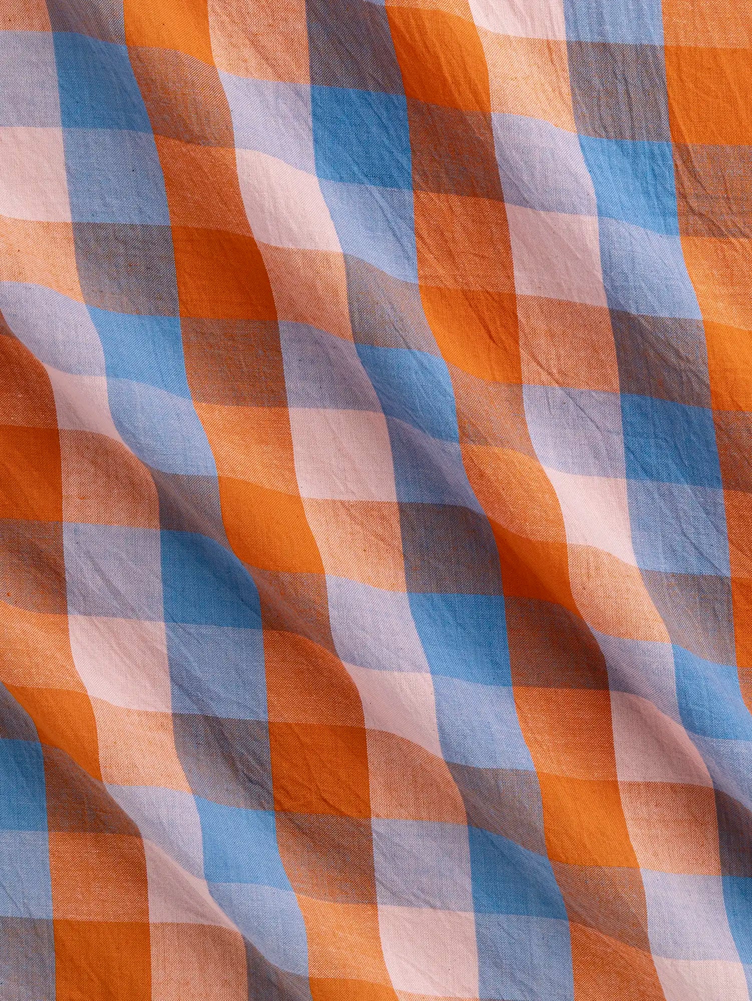 F-COT374-002-Kite-Handwoven-Check-Cotton-Sky-Petal-and-Orange-Core-Fabrics-scrunched.webp