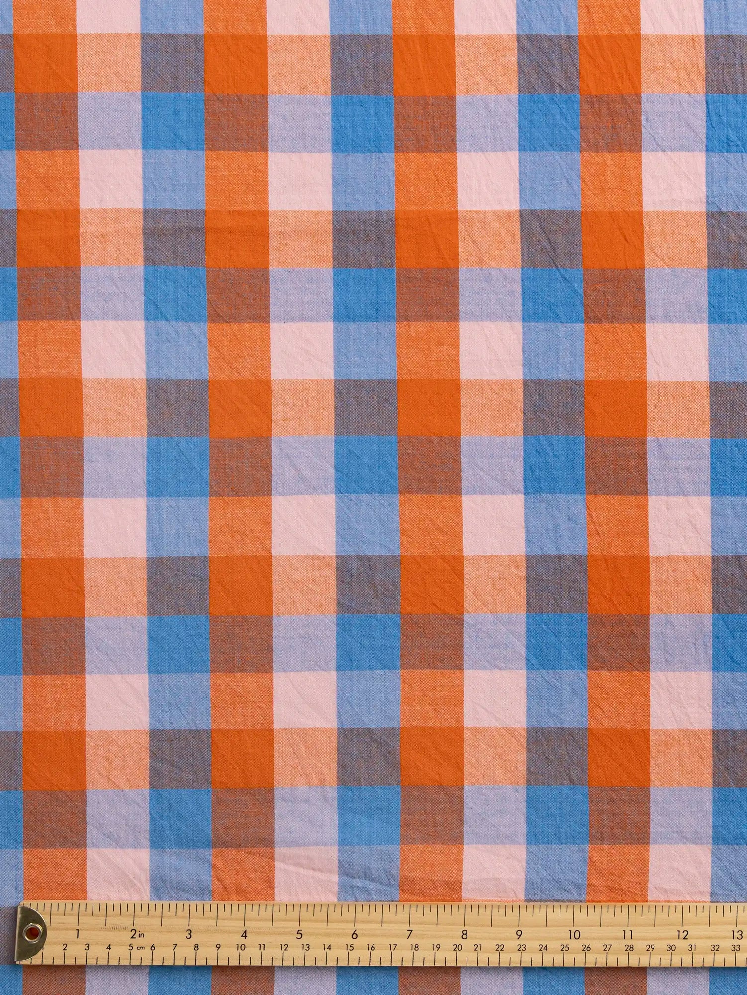 F-COT374-002-Kite-Handwoven-Check-Cotton-Sky-Petal-and-Orange-Core-Fabrics-ruler.webp