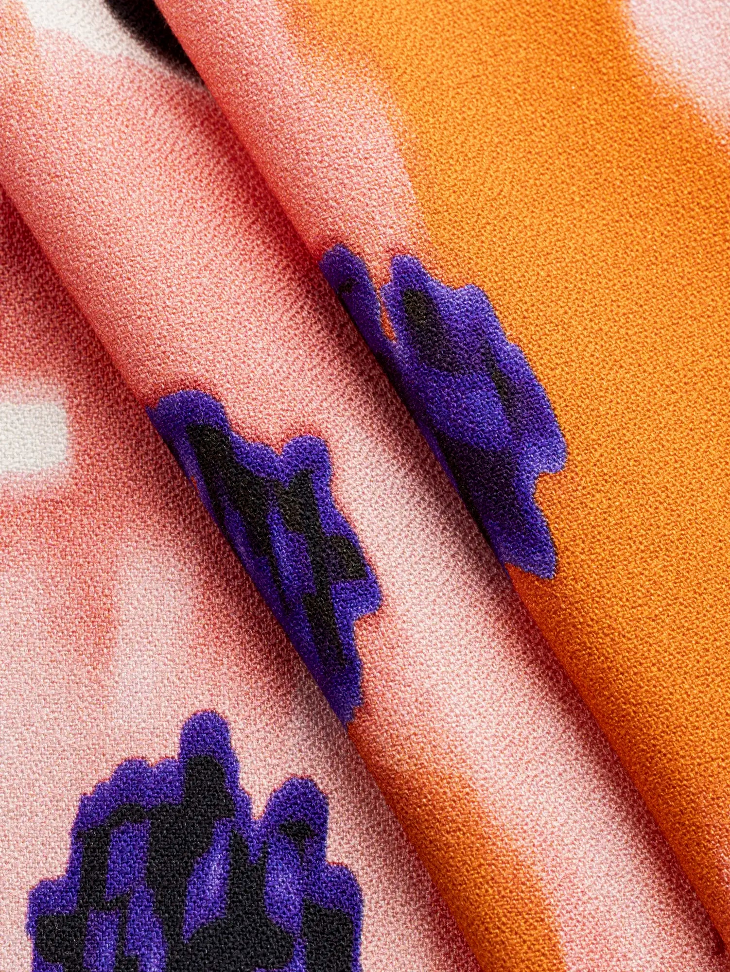 F-VIS307-Large-Dreamy-Flower-Print-FSC-Viscose-Crepe-White-Coral-and-Ultra-Violet-Core-Fabrics-fold.webp