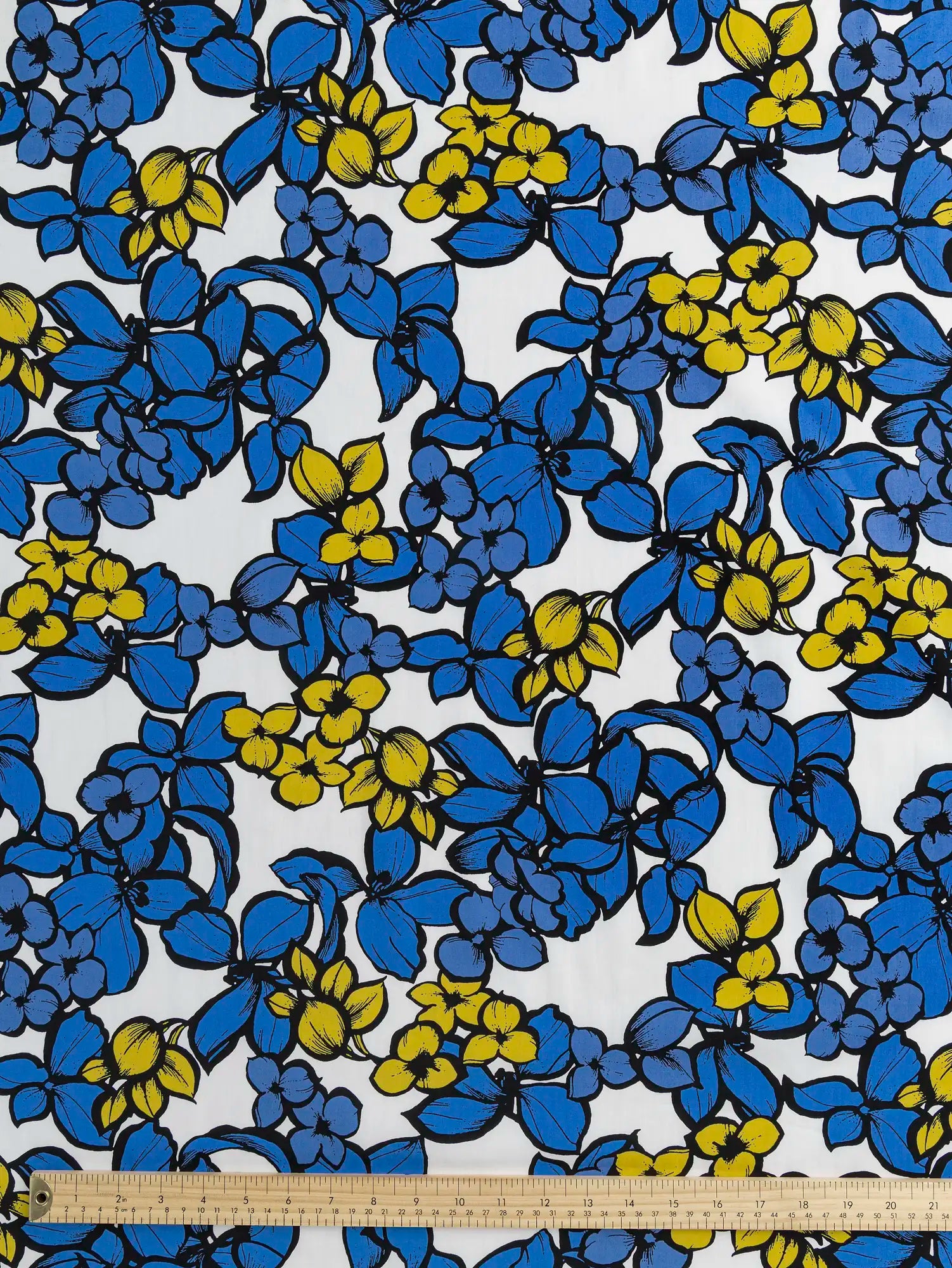 F-COT401-Large-Floral-Print-Japanese-Cotton-Lawn-White-Periwinkle-Black-and-Yellow-Core-Fabrics-ruler.webp