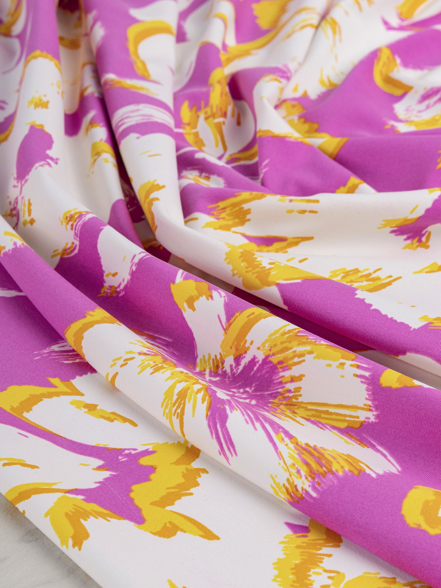 F-DEA039-Large-Floral-Swim-Performance-Knit-Deadstock-Pink-Yellow-and-White-Core-Fabrics-scrunched.JPG