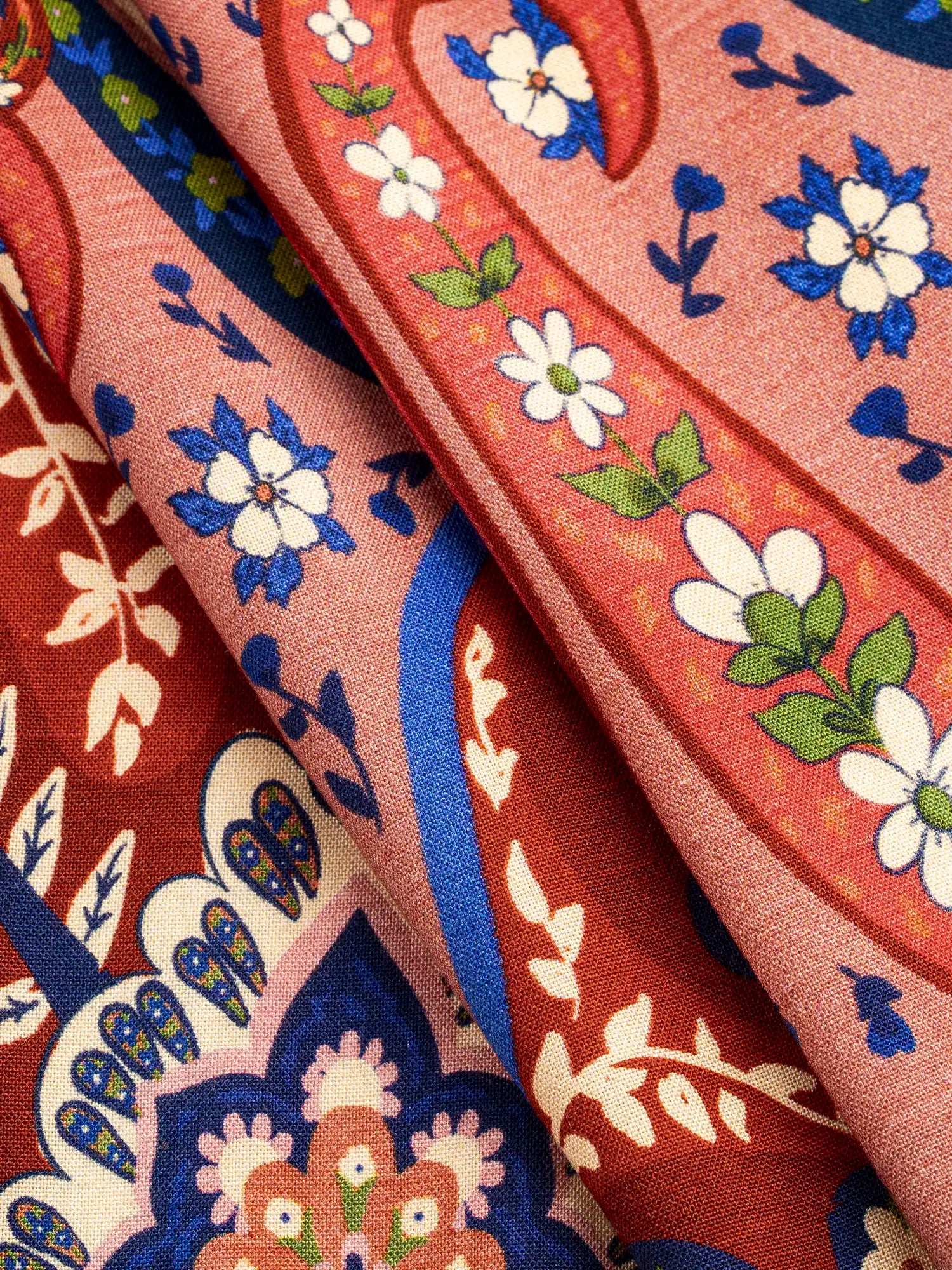 F-VIS300-Large-Folk-Print-Ecovero-Viscose-Red-Blue-and-Cream-Core-Fabrics-fold.webp