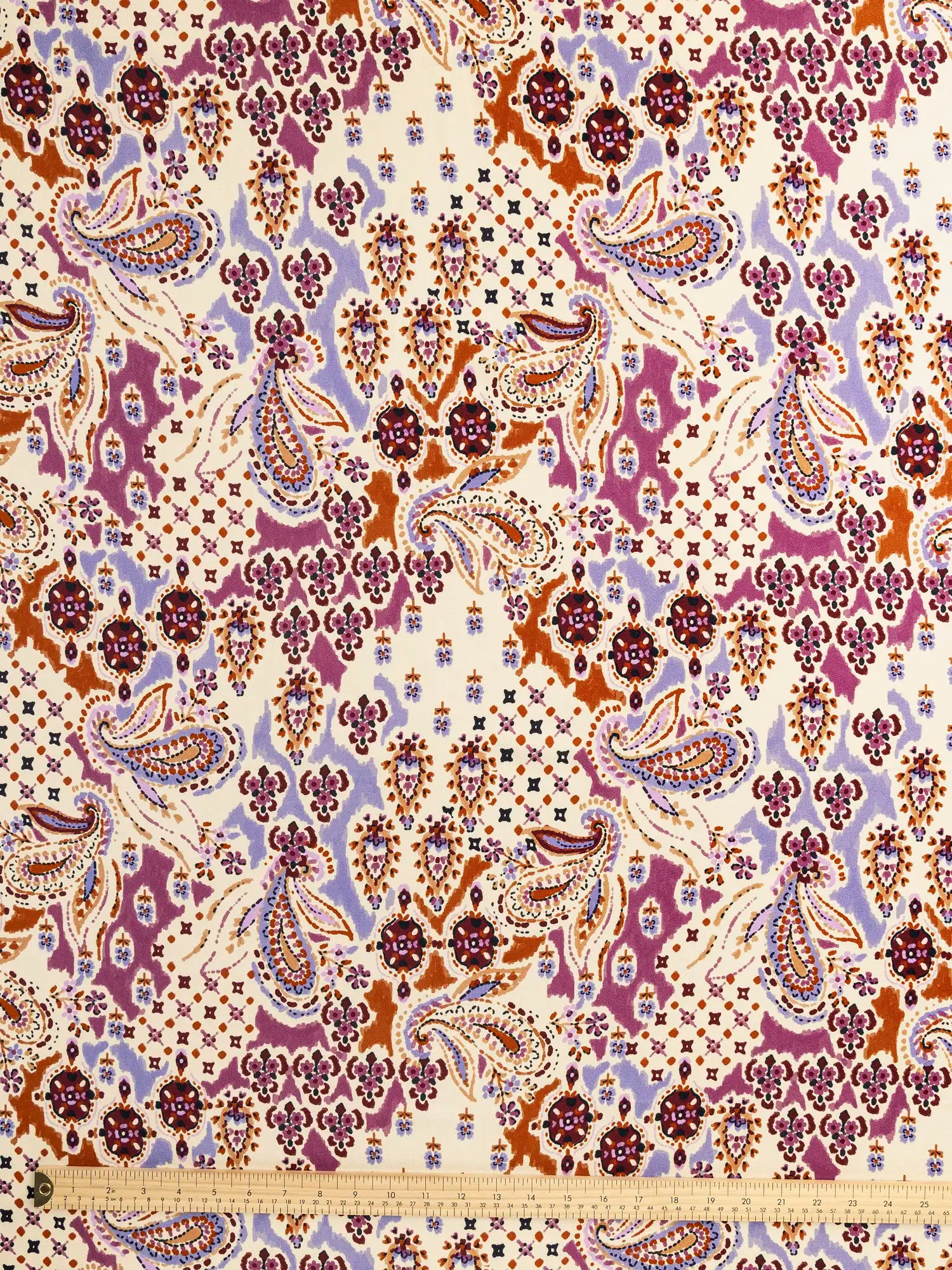 F-VIS304-Large-Paisley-Print-Ecovero-Crepe-Ivory-Lilac-and-Rhubarb-Core-Fabrics-ruler.webp