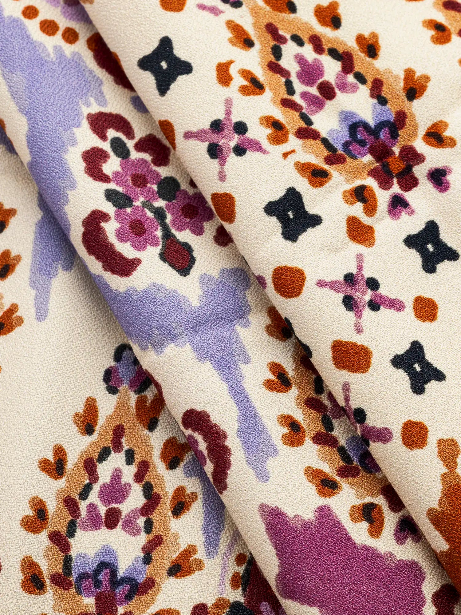 F-VIS304-Large-Paisley-Print-Ecovero-Crepe-Ivory-Lilac-and-Rhubarb-Core-Fabrics-fold.webp