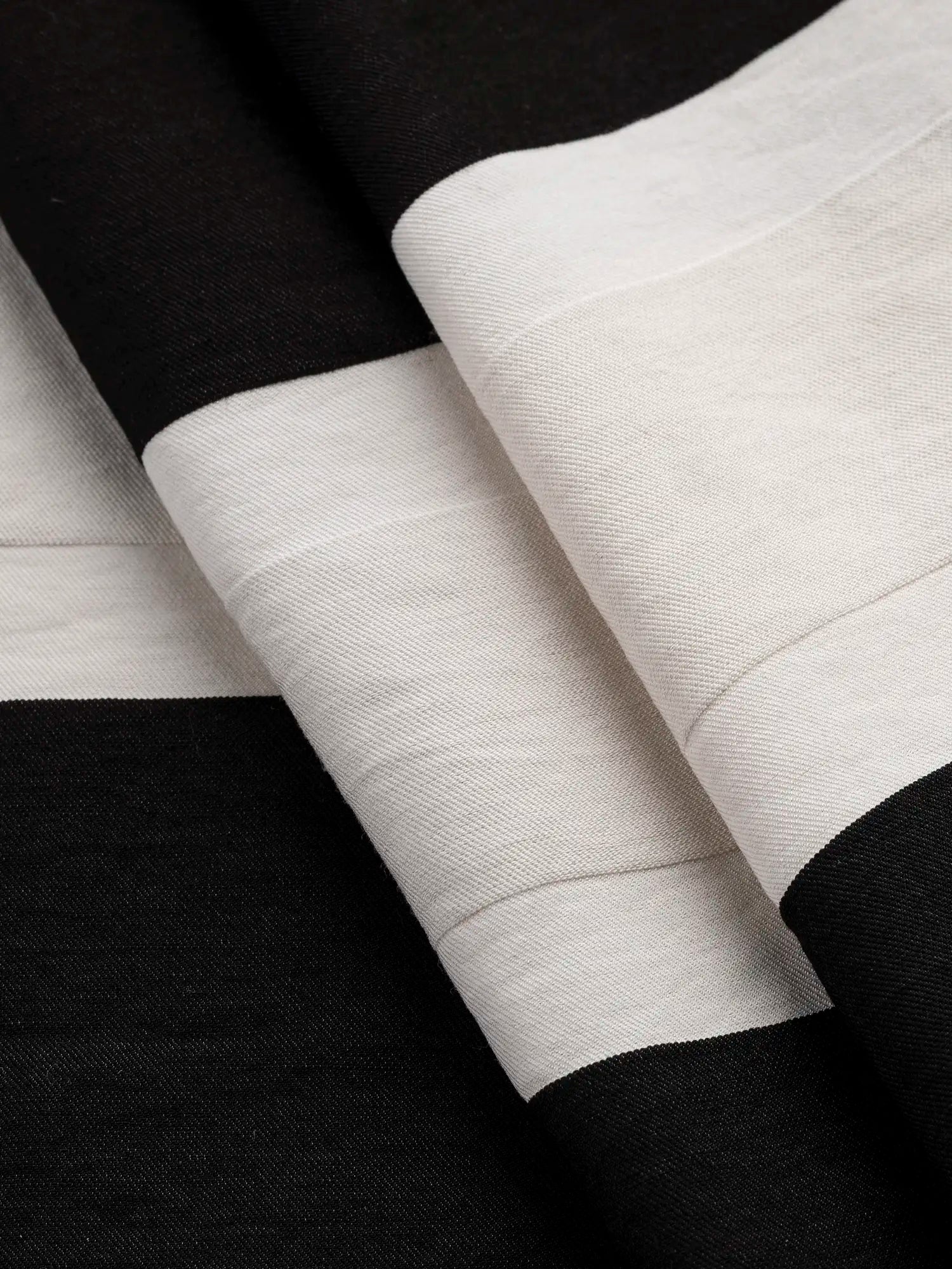 F-DEA171-Large-Textured-Stripe-Cotton-Viscose-Twill-Deadstock-Off-White-and-Black-Core-Fabrics-fold.webp