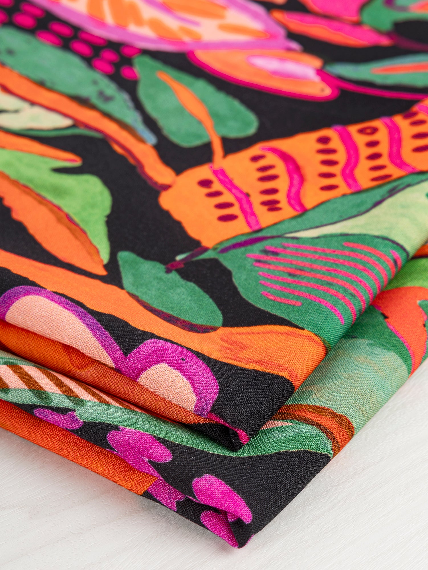 F-VIS248-001-Large-Tropical-Print-Ecovero-Viscose-Black-Red-Green-Core-Fabrics-fold.JPG