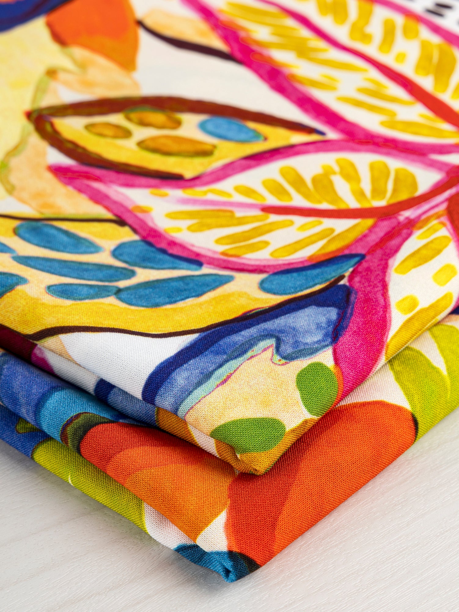 F-VIS248-002-Large-Tropical-Print-Ecovero-Viscose-White-Yellow-Cobalt-Core-Fabrics-fold.JPG