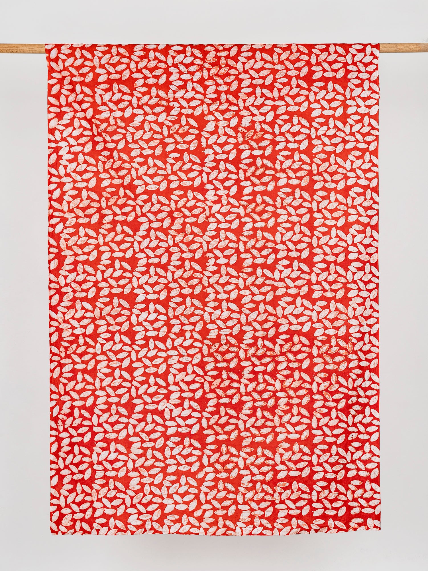 F-COT323-Leaf-Artisanal-Cotton-Batik-Red-White-Core-Fabrics-draped