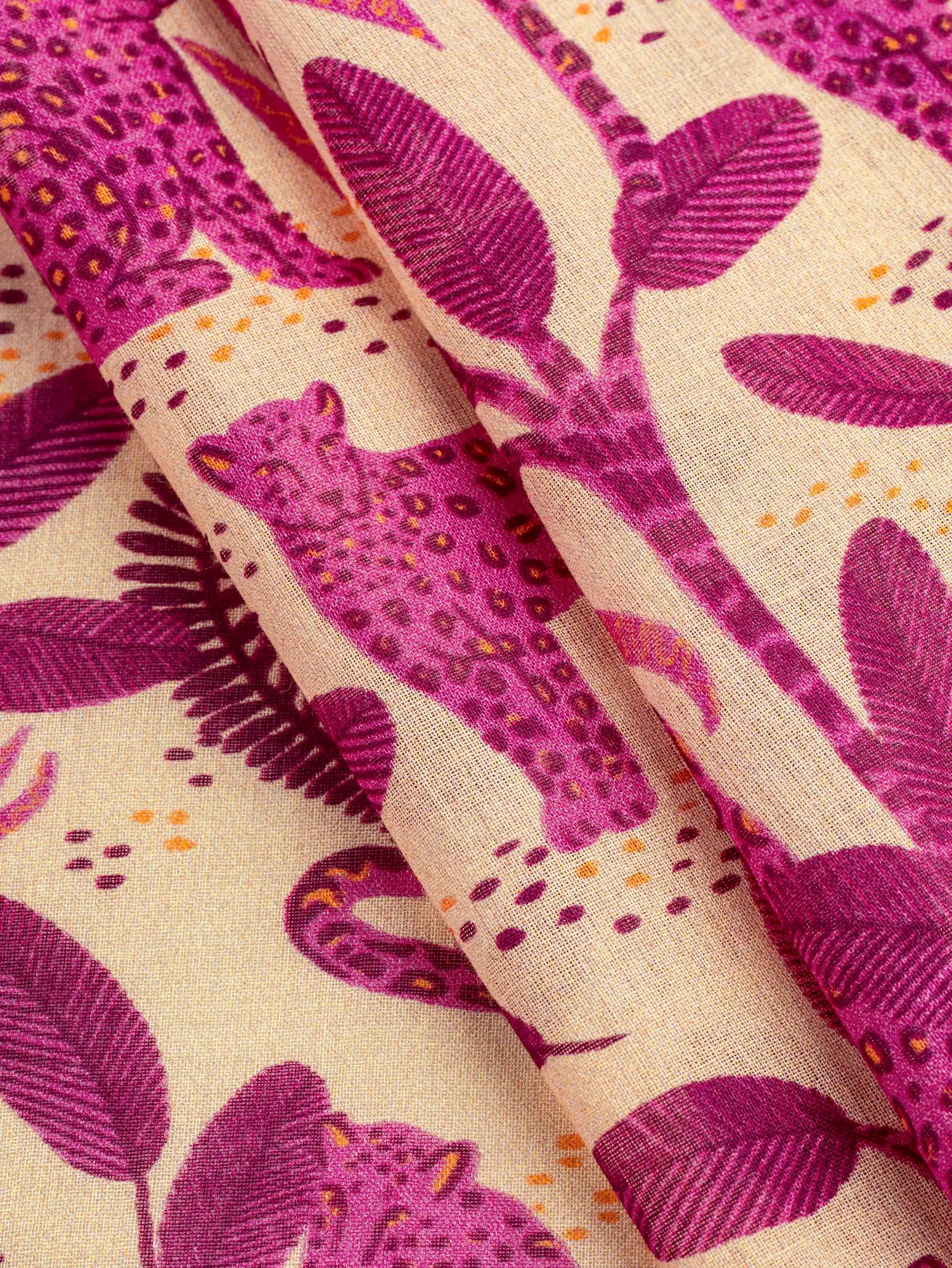 F-COT434-Leopard-Print-Cotton-Voile-Cream-Magenta-and-Apricot-Core-Fabrics-fold.webp