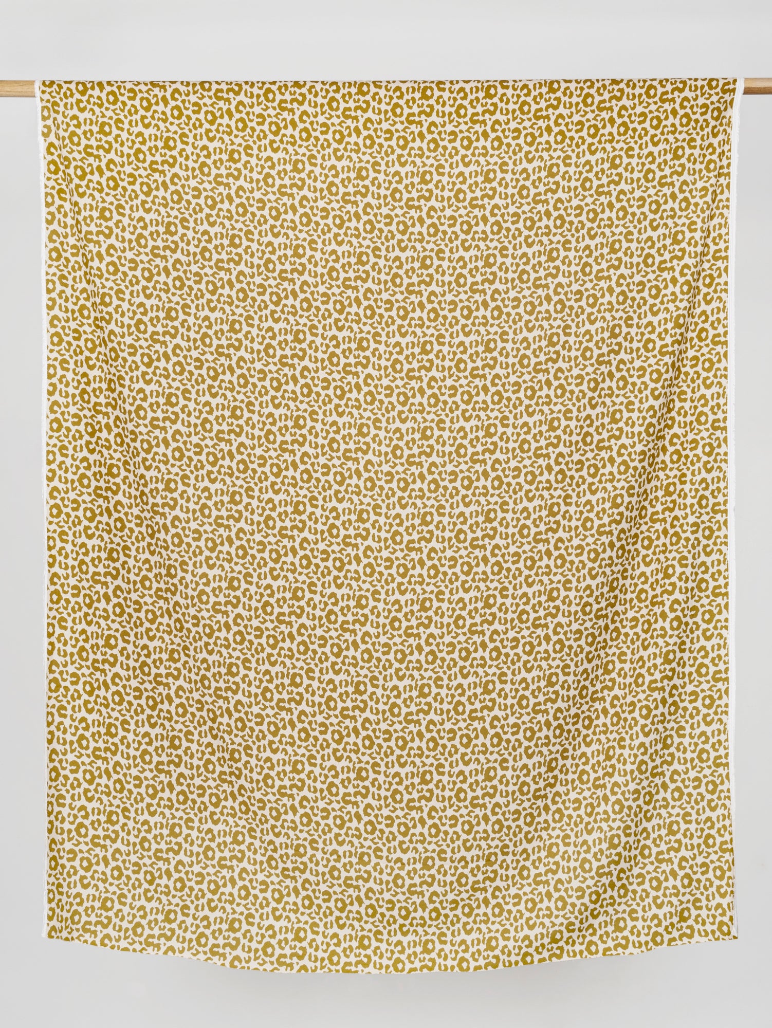 F-VIS235-Leopard-Print-Ecovero-Viscose-Crepe-Cream-Gold-Core-Fabrics-draped
