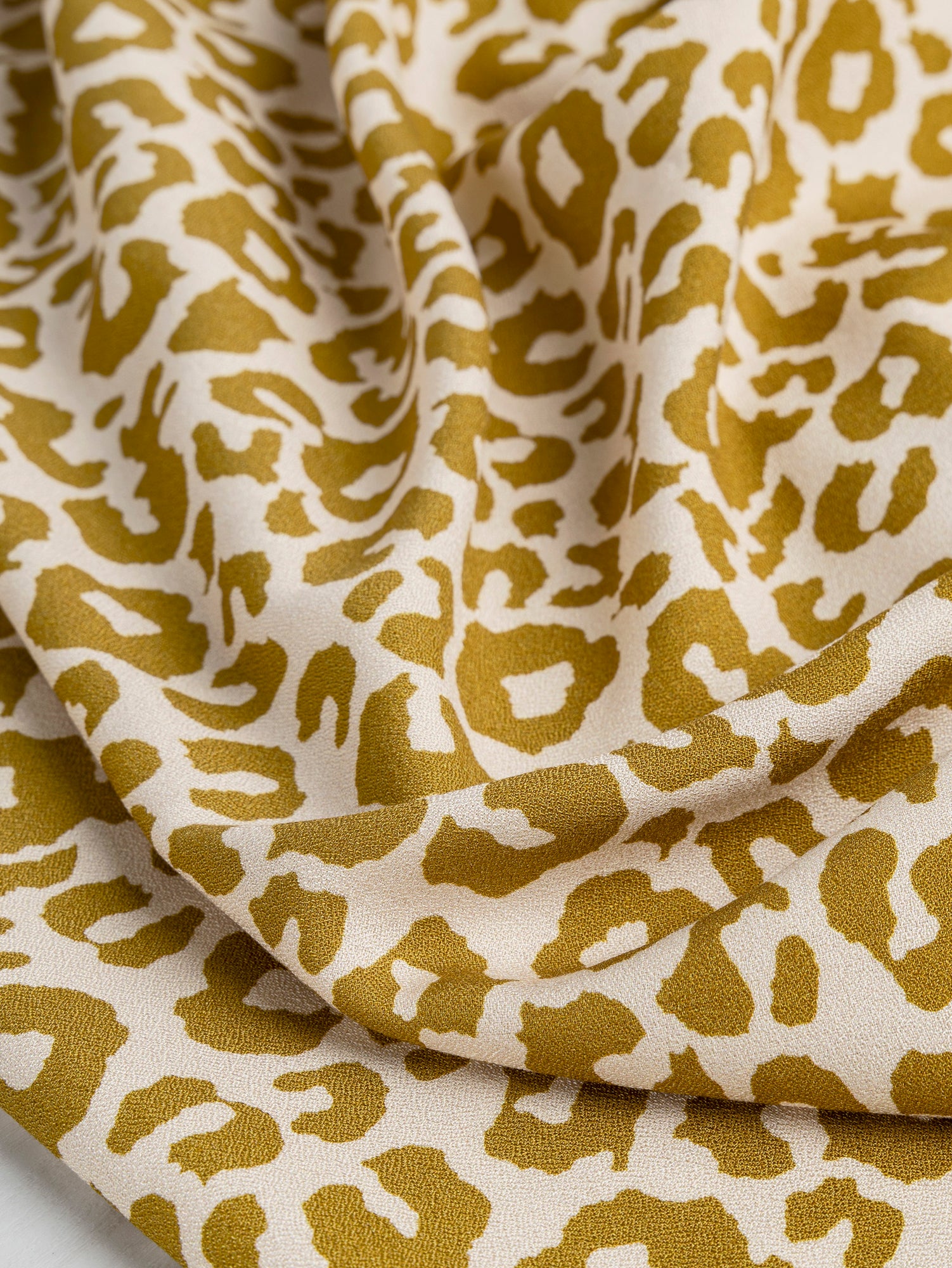 F-VIS235-Leopard-Print-Ecovero-Viscose-Crepe-Cream-Gold-Core-Fabrics-scrunched