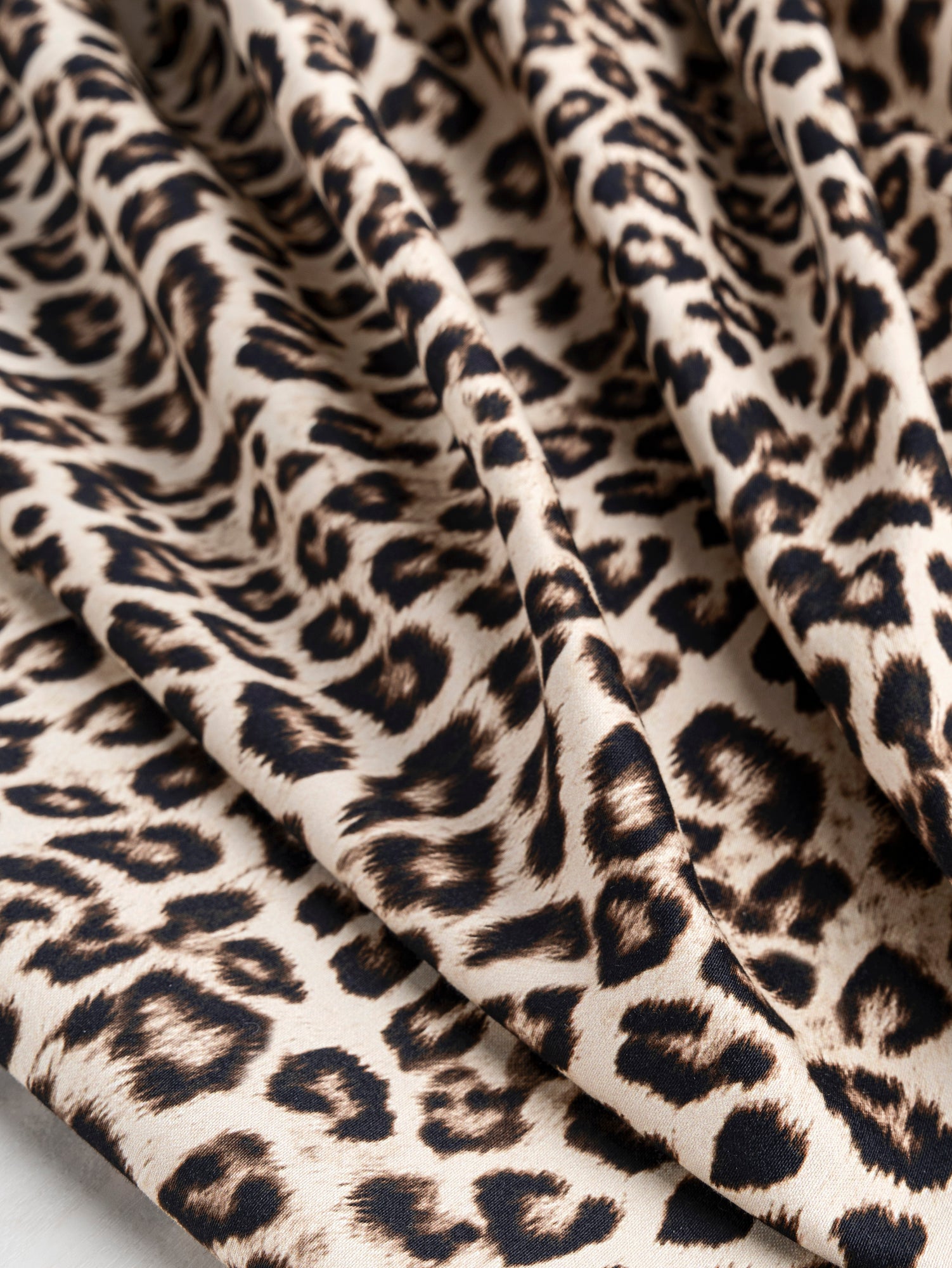 F-COT326-Leopard-Print-Stretch-Cotton-Bottomweight-Beige-Black-Core-Fabrics-scrunched