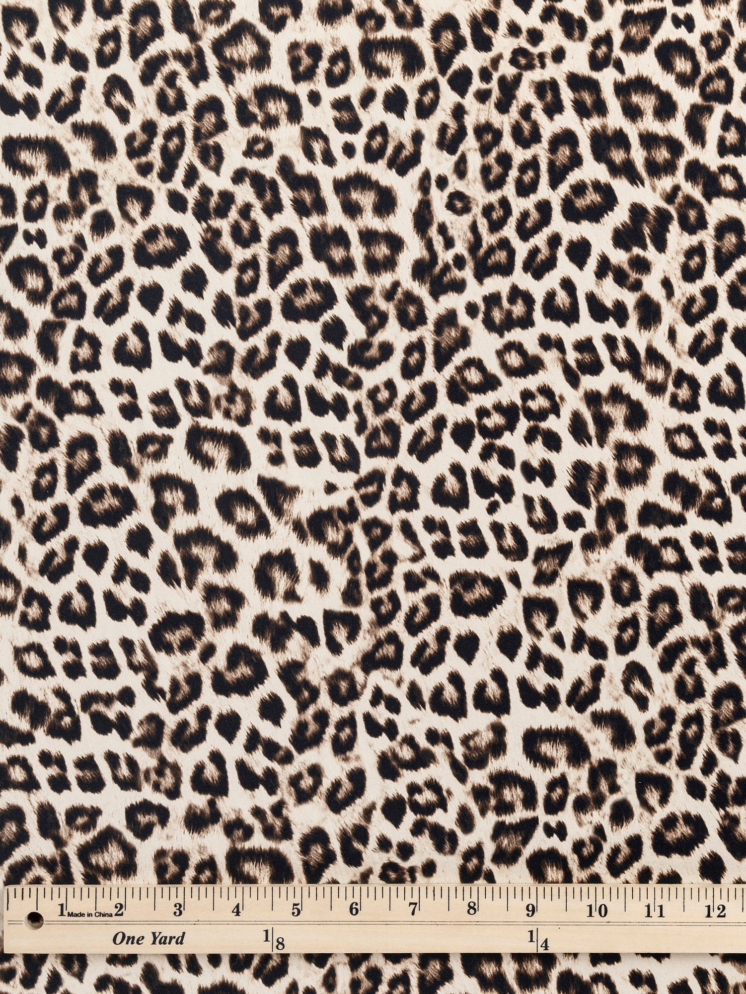 F-COT326-Leopard-Print-Stretch-Cotton-Bottomweight-Beige-Black-Core-Fabrics-ruler