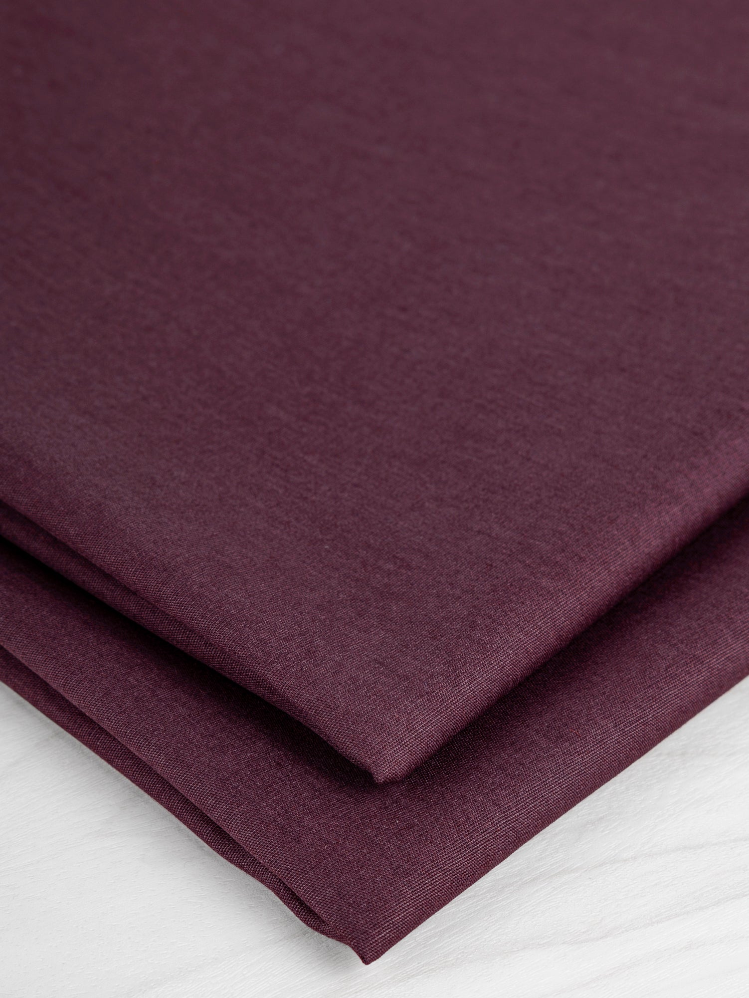 F-COT137-029-Lightweight-Silky-Cotton-Poplin-Burgundy-Core-Fabrics-fold