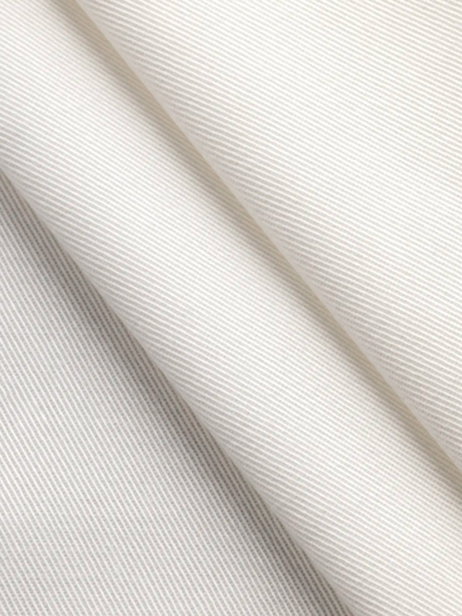 F-DEA180-Lightweight-Stretch-Cotton-Twill-Deadstock-Ivory-Core-Fabrics-fold.webp