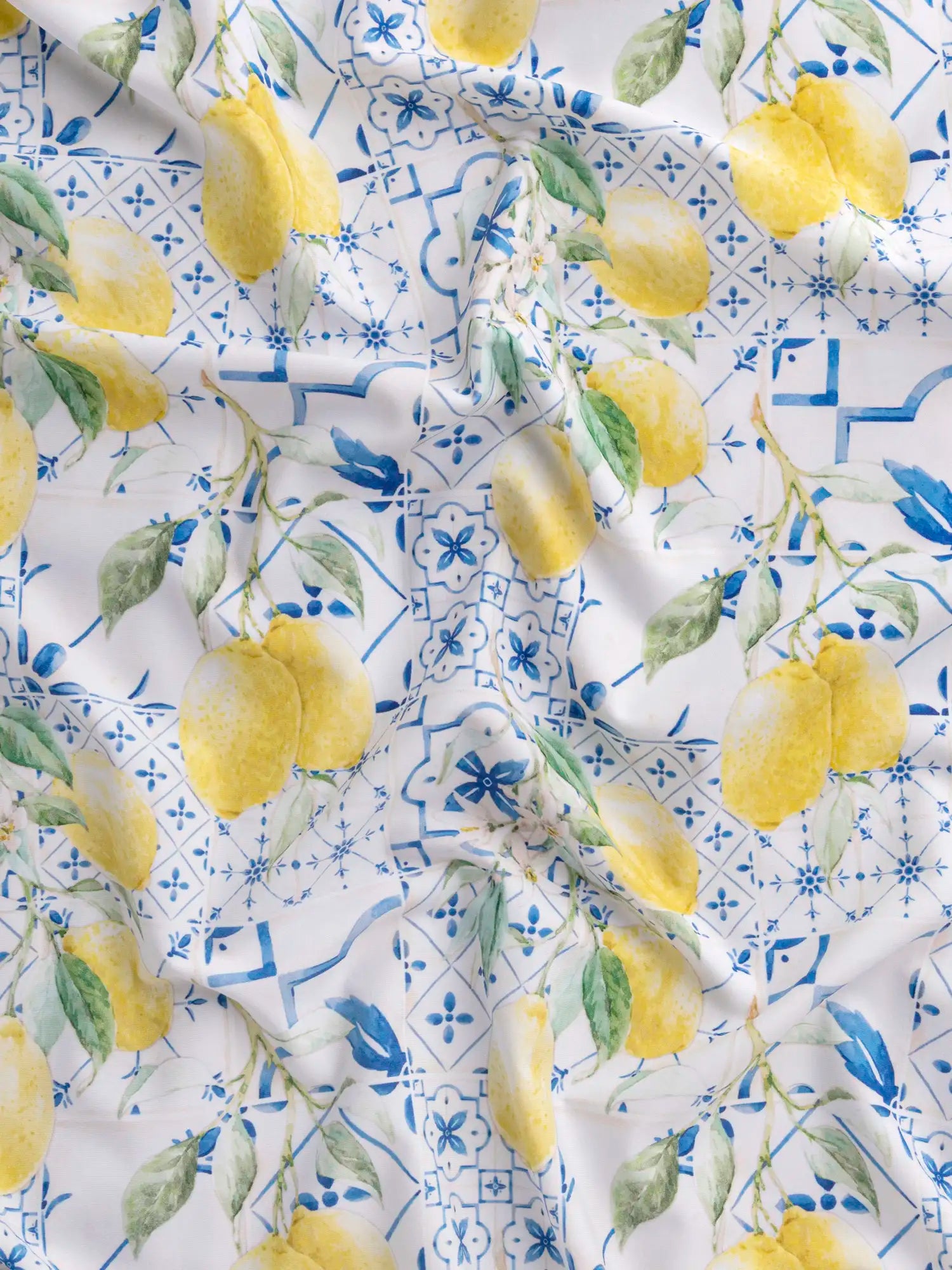 F-NYL022-Limoncello-Tile-Print-Swim-Performance-Knit-Yellow-Blue-and-White-Core-Fabrics-scrunched.webp
