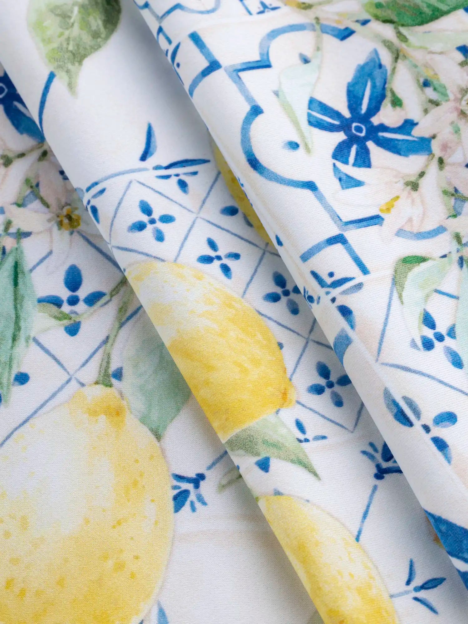 F-NYL022-Limoncello-Tile-Print-Swim-Performance-Knit-Yellow-Blue-and-White-Core-Fabrics-fold.webp
