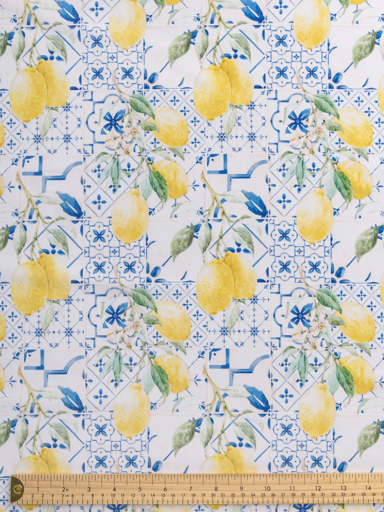 F-NYL022-Limoncello-Tile-Print-Swim-Performance-Knit-Yellow-Blue-and-White-Core-Fabrics-ruler.webp